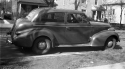 This is the car I literally grew up in, having been born in 1940. Dad and Mom kept this car until about 1949 and traded it for a '48 DeSoto. For me it was like losing one of the family. This is in front of our house in Maplewood, Missouri, about 1946. 616 Negative. View full size.
I Love This CarIt's looks to be quite roomy, front and especially the back.  There would have been lot of space for you play, sans seat belts, in those good old days.  Maybe people didn't need seat belts because the cars were made of steel, not the aluminum foil of today's models.
[Today's car's are quite a bit sturdier, not to mention crashworthy. - Dave]
(ShorpyBlog, Member Gallery, Cars, Trucks, Buses)