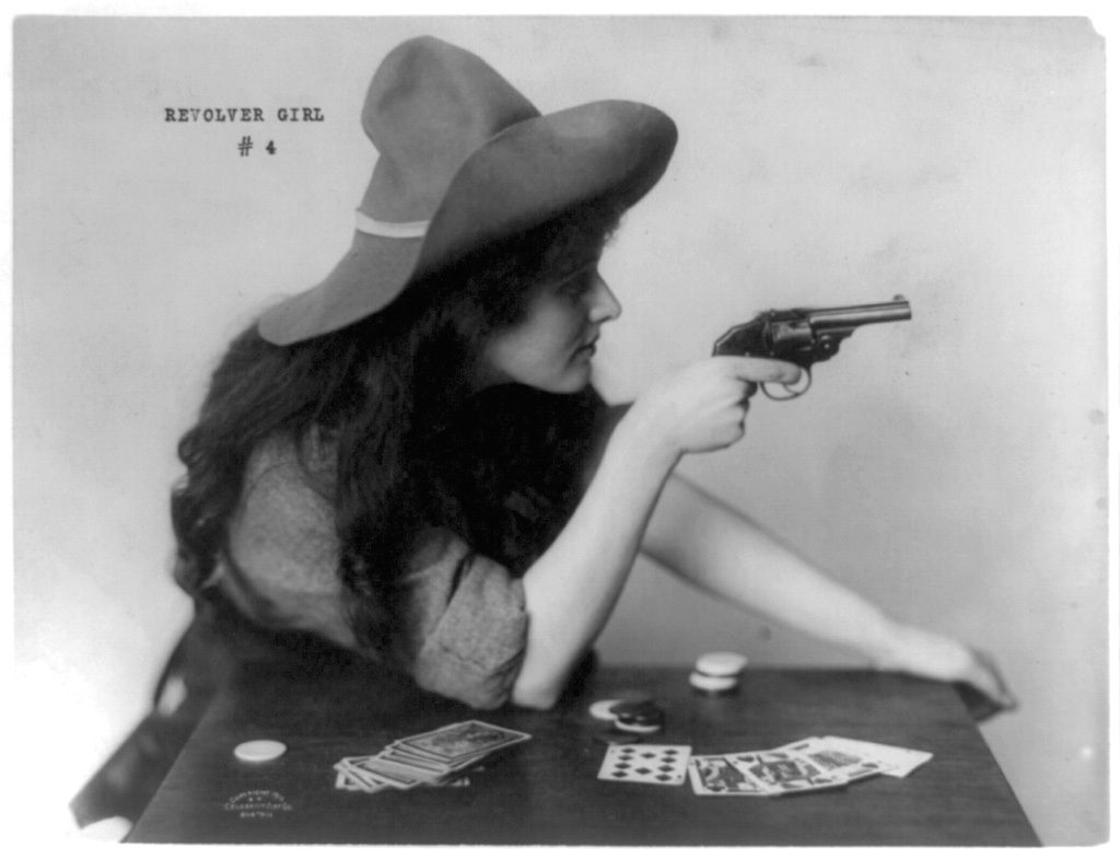 An obviously posed photo of a woman gambler brandishing her weapon. Celebrity Art Co., Boston, c. 1912. View full size.
