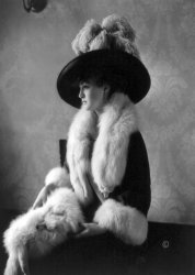 Louise Cromwell poses in fox furs, c. 1911. This is likely the wealthy heiress who married General Douglas MacArthur on February 14, 1922. View full size.