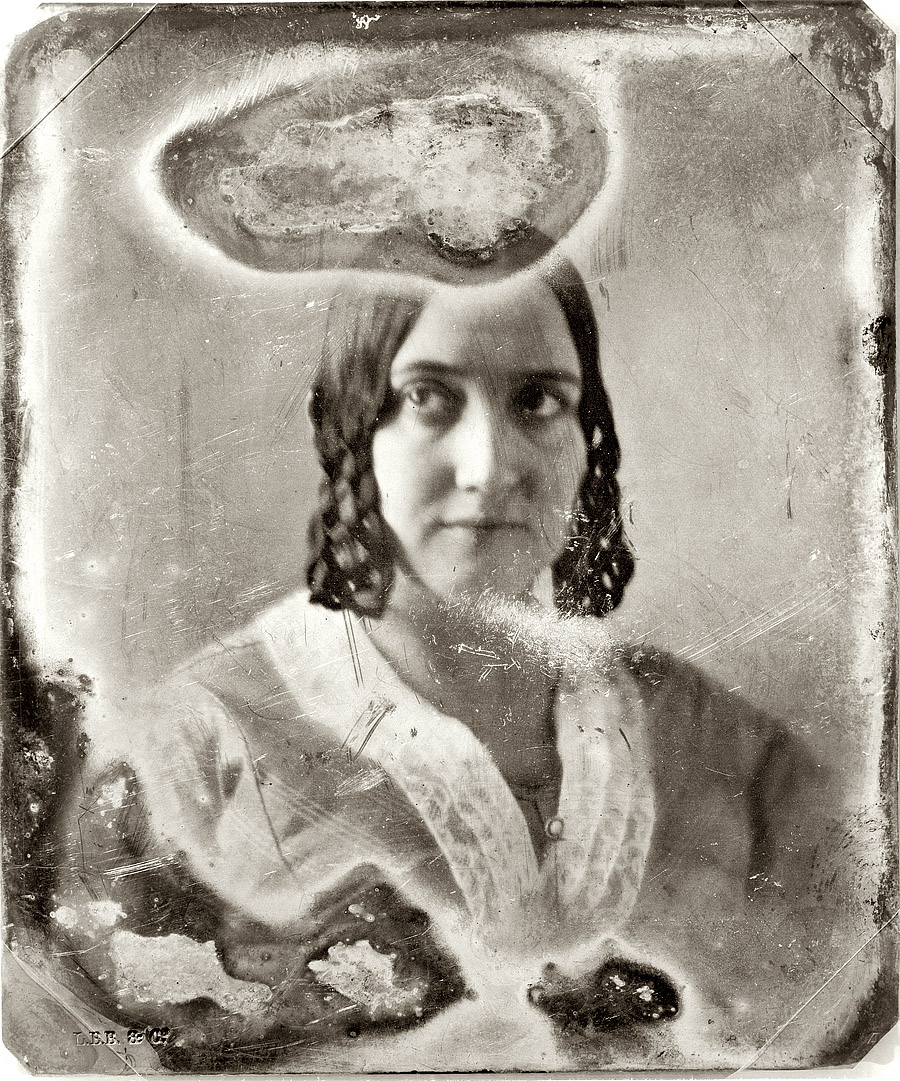 Circa 1844-1860, another portrait sitter from the studio of Mathew Brady, this one with a striking amoeba-shaped chapeau. "Unidentified woman, head and shoulders portrait, facing front. Sixth-plate daguerreotype. Hallmark: Rinhart 31. Scratched on back of plate: 304. Same sitter as in Dag No. 116." View full size.