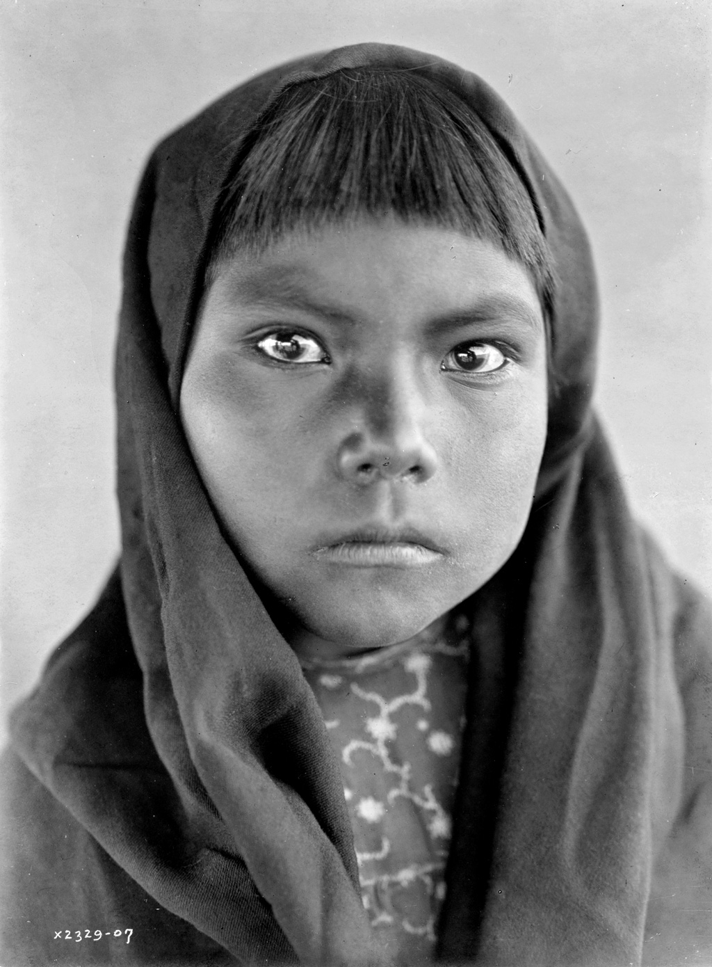 A Qahatika Native-American child. Photograph by Edward S. Curtis, c. 1907. View full size.
