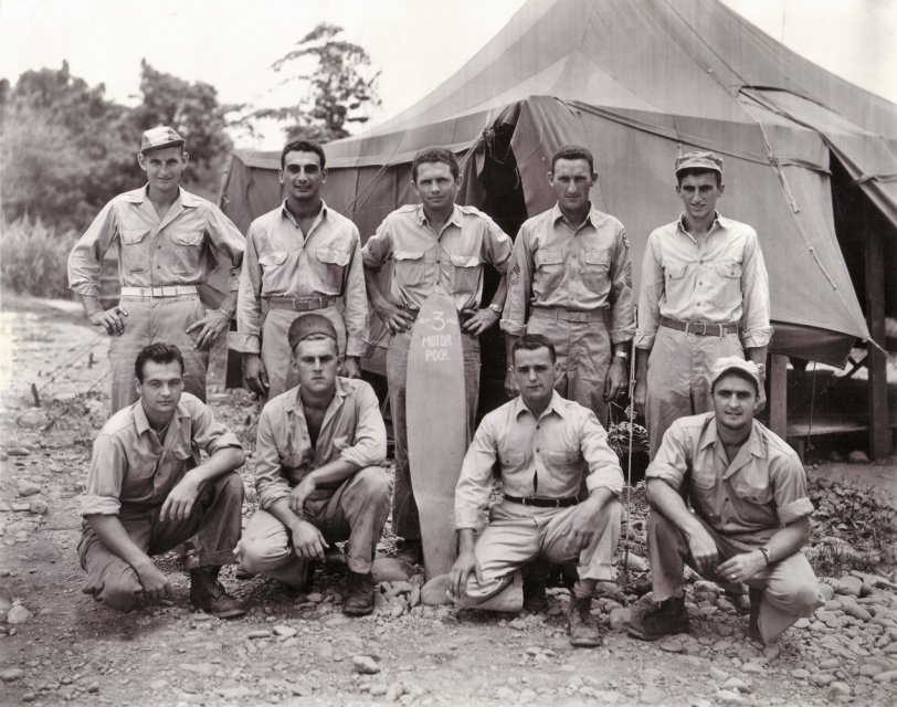 Another picture of my dad from the negatives discovered in the basement of my mom's home. He is the second from the left on the bottom row.  He served in New Guinea and the Philippines with the Grim Reapers, aka the 3rd attack group of the 5th Army Air Corps.  View full size.
