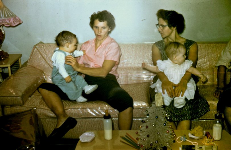 Kodachrome taken in my grandmothers living room. Her sister Marge to the left and my grandma holding my aunt Candy on the right. Taken during Christmas 1958 in Chicago Illinois. View full size.
