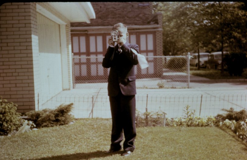 Kodachrome slide of my 8-year-old father with a camera. The year is 1956 and the location is on Wellington in Chicago Illinois. View full size.
