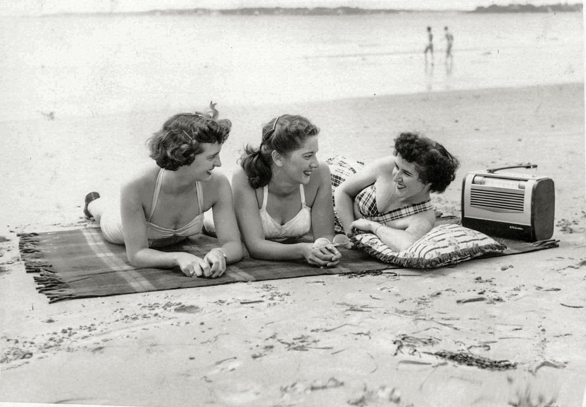 My mother, far left, with some of her young and attractive co-workers from Salem Gas & Electric posing for the New England Electric System magazine cover in the early spring of 1951.  The photo shoot took place on King's Beach in Swampscott, Massachusetts. Enjoying ideal beach weather are Phyllis Collins (Salem Gas), Betty Konopnicki (Salem Electric) and Lil Bouchard (Salem Gas). View full size.