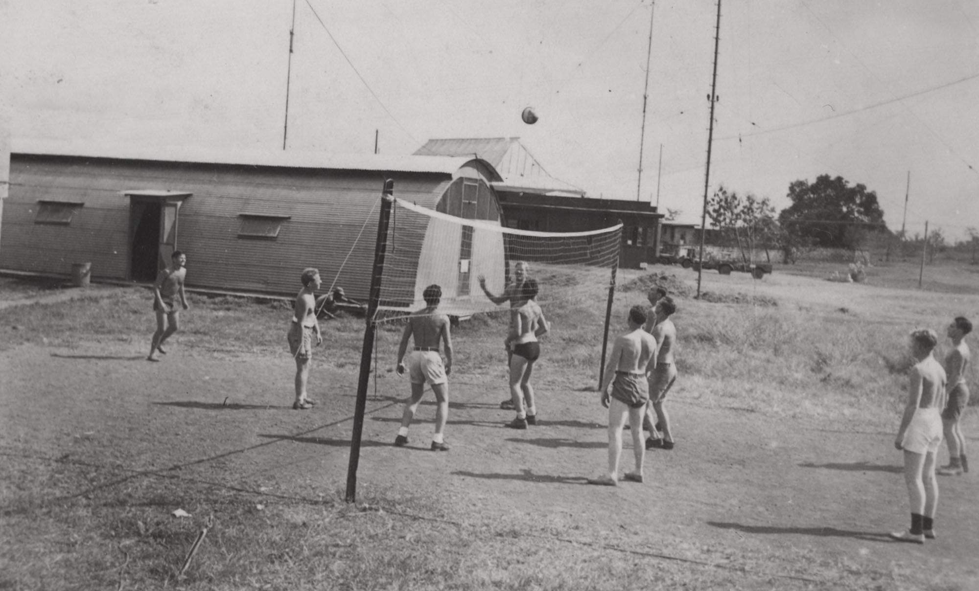 Sailors playing volleyball at the barracks on the naval base in Subic Bay, Philippines after the end of WWII. My father, who took this photo, was shipped there after the war ended in 1945 to maintain radar antennas.