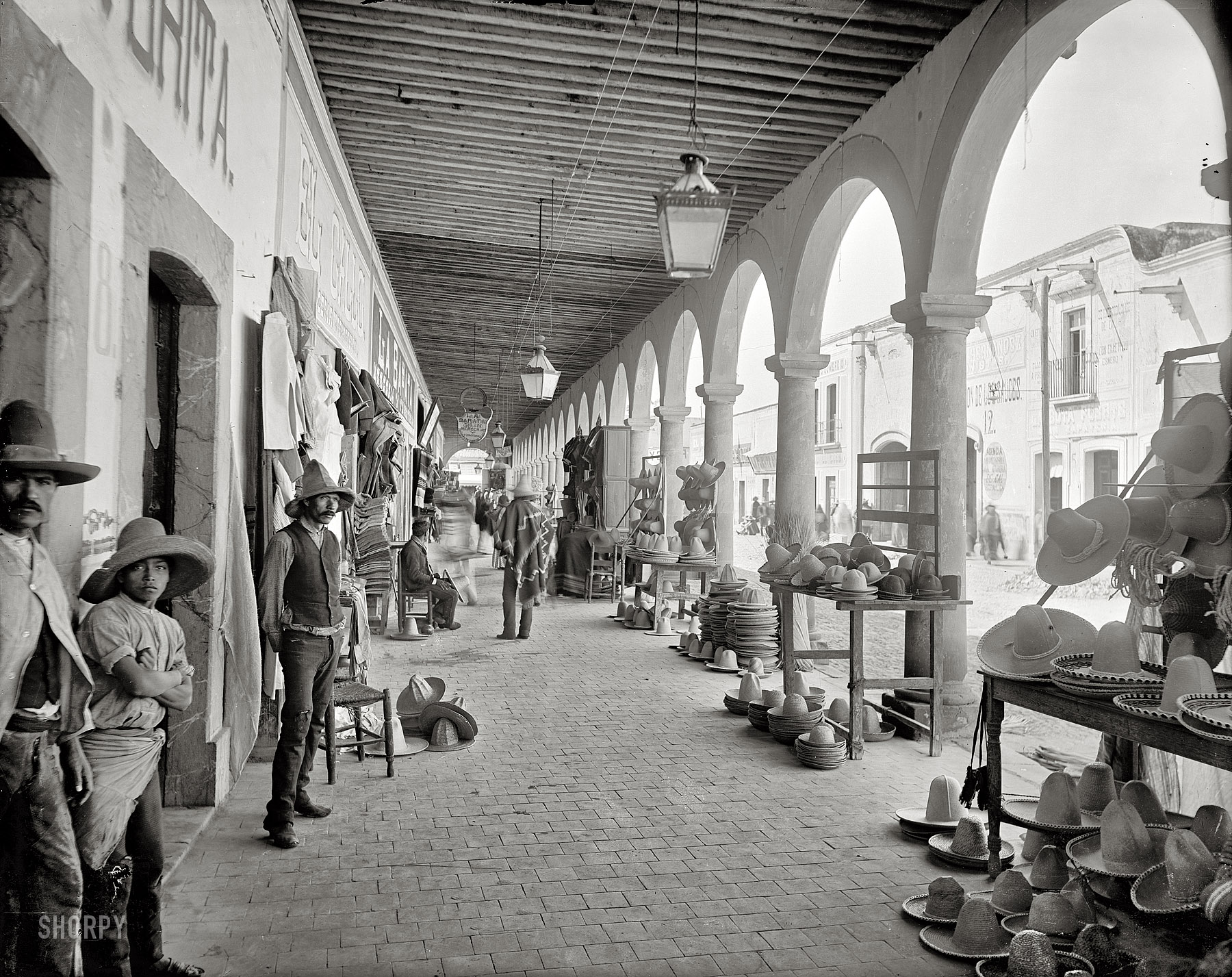 Aguascalientes, Mexico, circa 1890s. "Portales of the market of San Marcos." Glass negative by William Henry Jackson, Detroit Publishing Co. View full size.