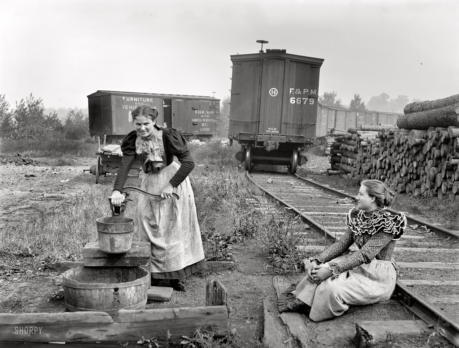 Appleton, Wisconsin, circa 1890s. "Girls of the paper mills." Evidently taking a water break. Detroit Publishing Company glass negative. View full size.