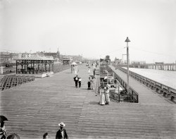 New Jersey circa 1905. "Boardwalk, Asbury Park." "Notice: Bicycle riding on the plank walk is strictly prohibited." Detroit Publishing Co. View full size.