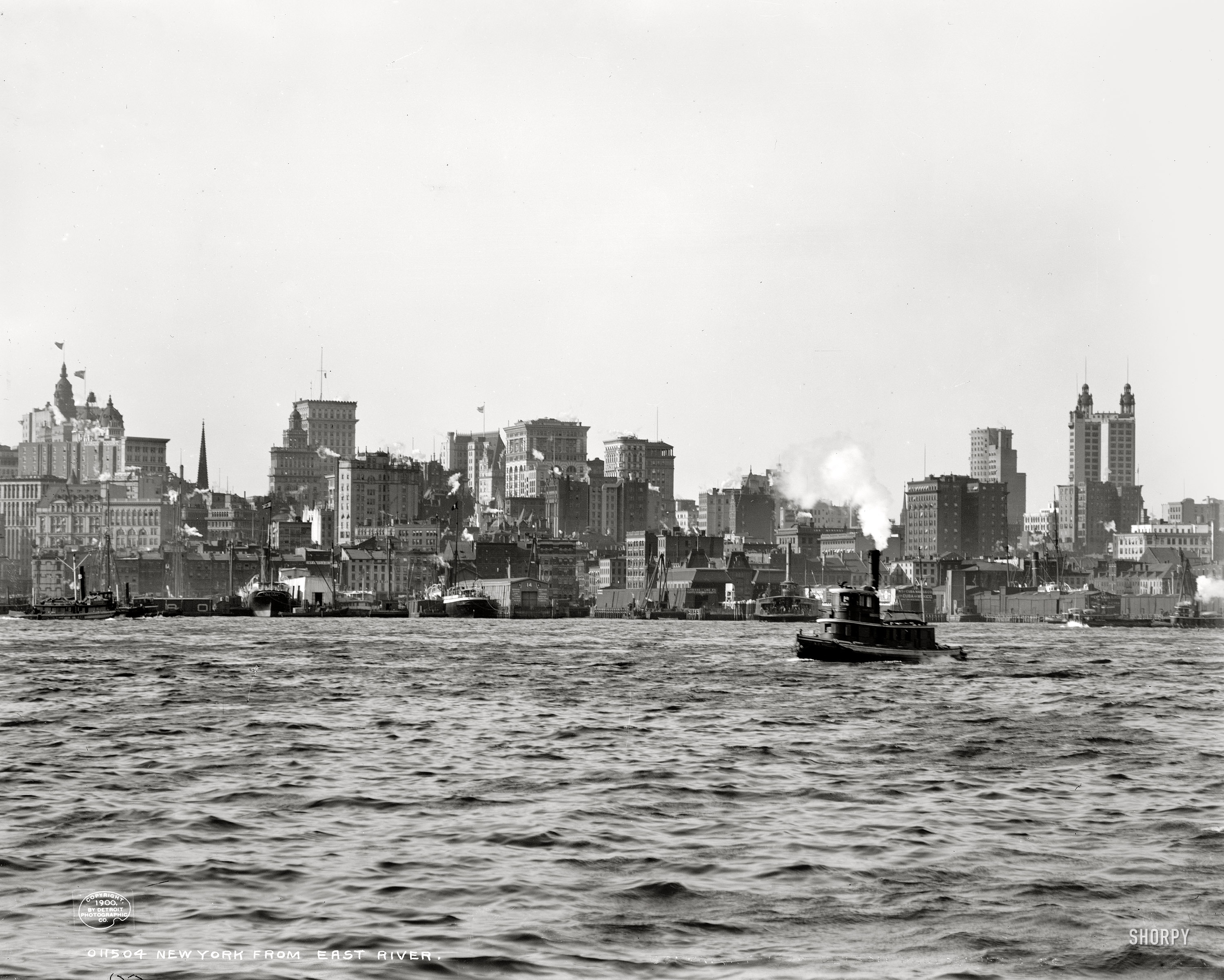 Circa 1900. "New York from East River." At right we see the dual domes of the 26-story Park Row building, at 391 feet the world's tallest office tower at the turn of the century. Dry plate glass negative, Detroit Publishing Co. View full size.