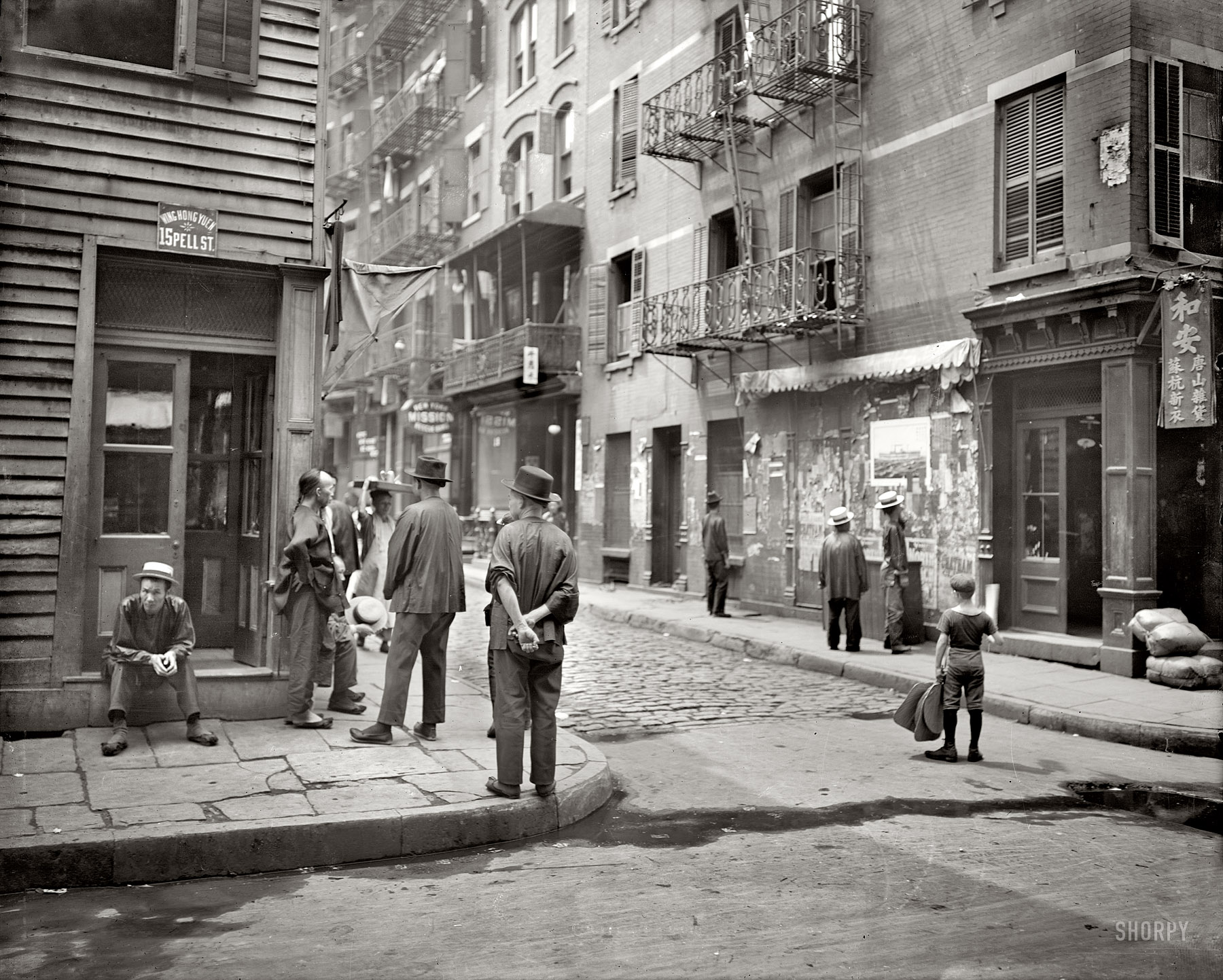 New York circa 1900. "In Chinatown, Pell Street." Photo by Byron. 8x10 inch dry plate glass negative, Detroit Publishing Company. View full size.