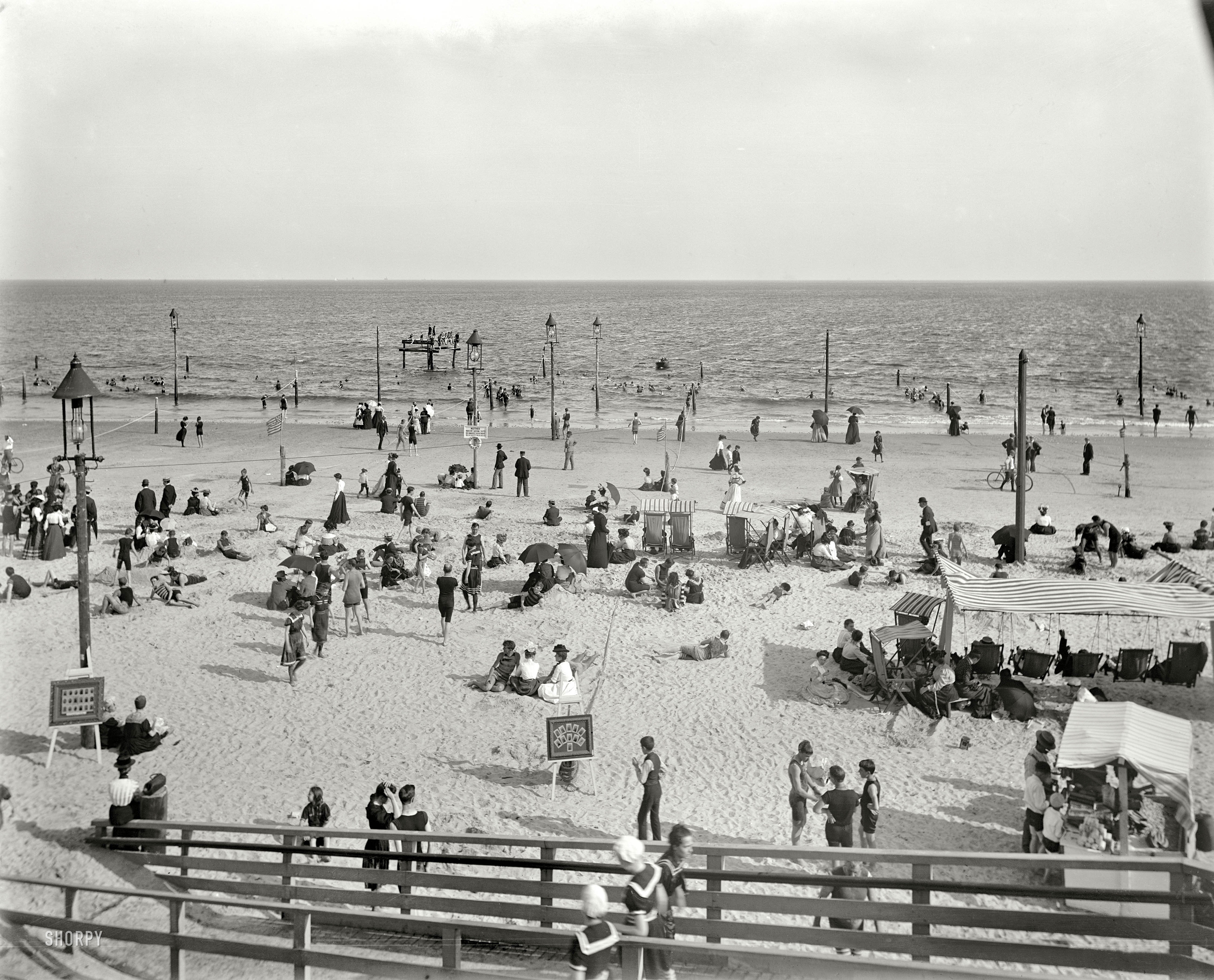 Brooklyn, New York, circa 1901. "Brighton Beach." Where, as noted on the sign, "Neither indecent bathing suits nor immodest deportment will be tolerated." 8x10 inch dry plate glass negative, Detroit Publishing Company. View full size.