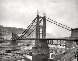Pittsburgh circa 1900. "Point Bridge and coal barges." Note the Duquesne Incline railway next to the Solomon & Ruben sign. 8x10 glass negative. View full size.