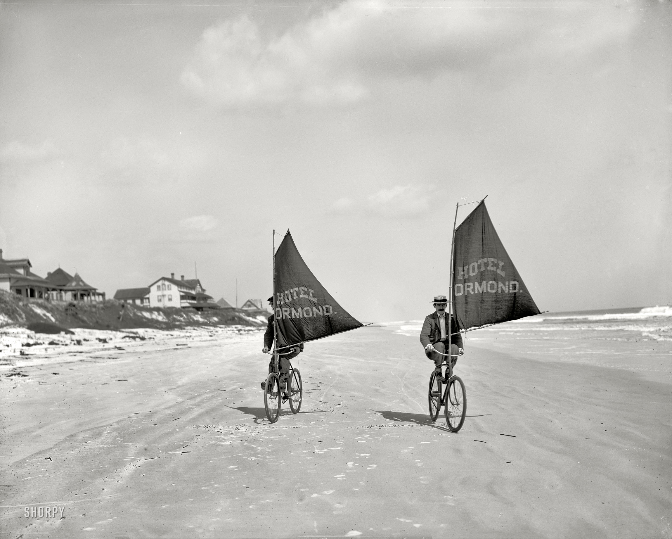 Volusia County, Florida, circa 1903. "Sailing bicycles on the beach at Ormond." 8x10 inch dry plate glass negative, Detroit Publishing Company. View full size.