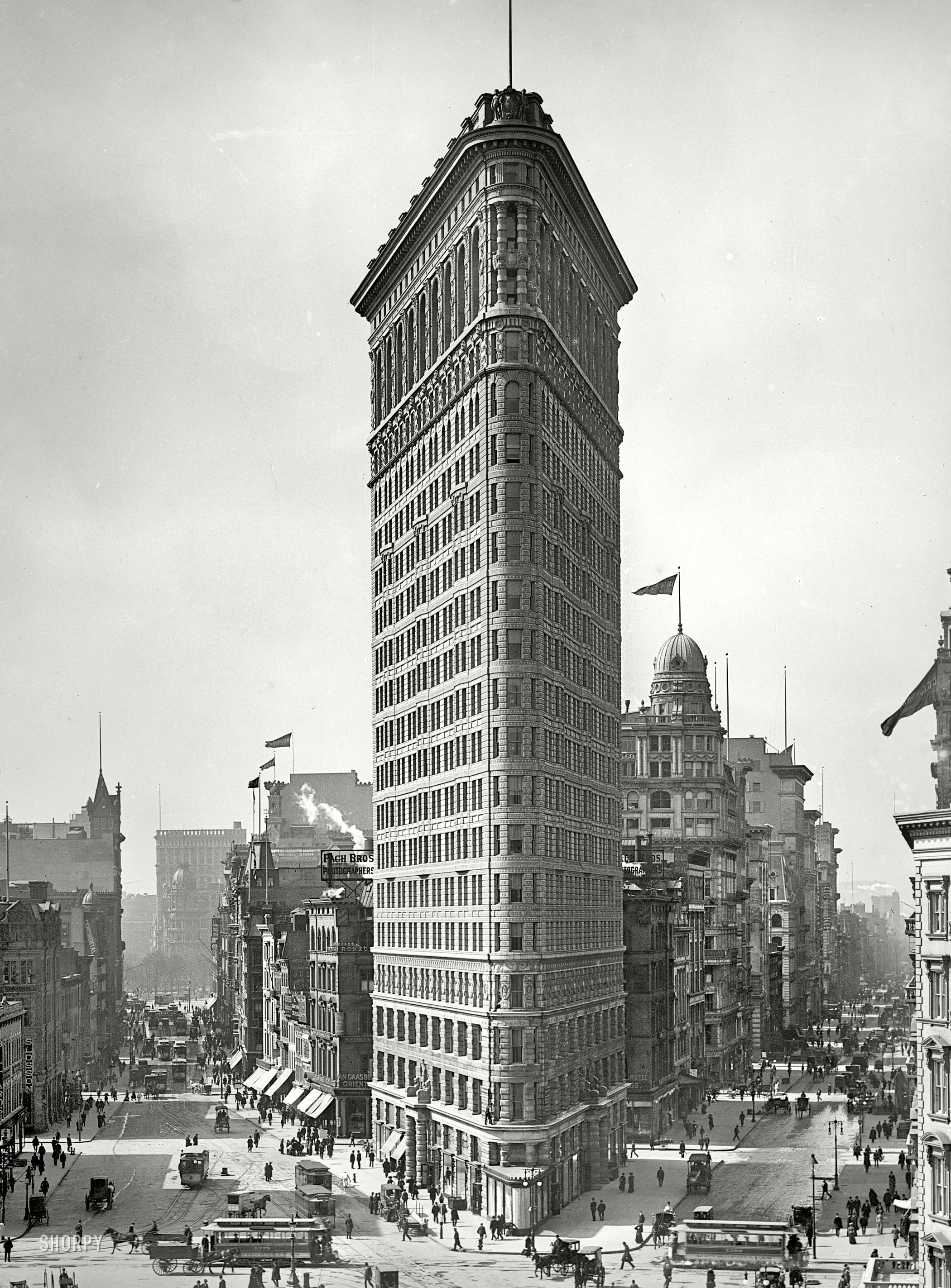 The Flatiron Building circa 1903, with Broadway on the left and Fifth Avenue on the right, and lots of street traffic all around this early skyscraper shortly after its completion. 8x10 inch glass negative, Detroit Publishing Co. View full size.