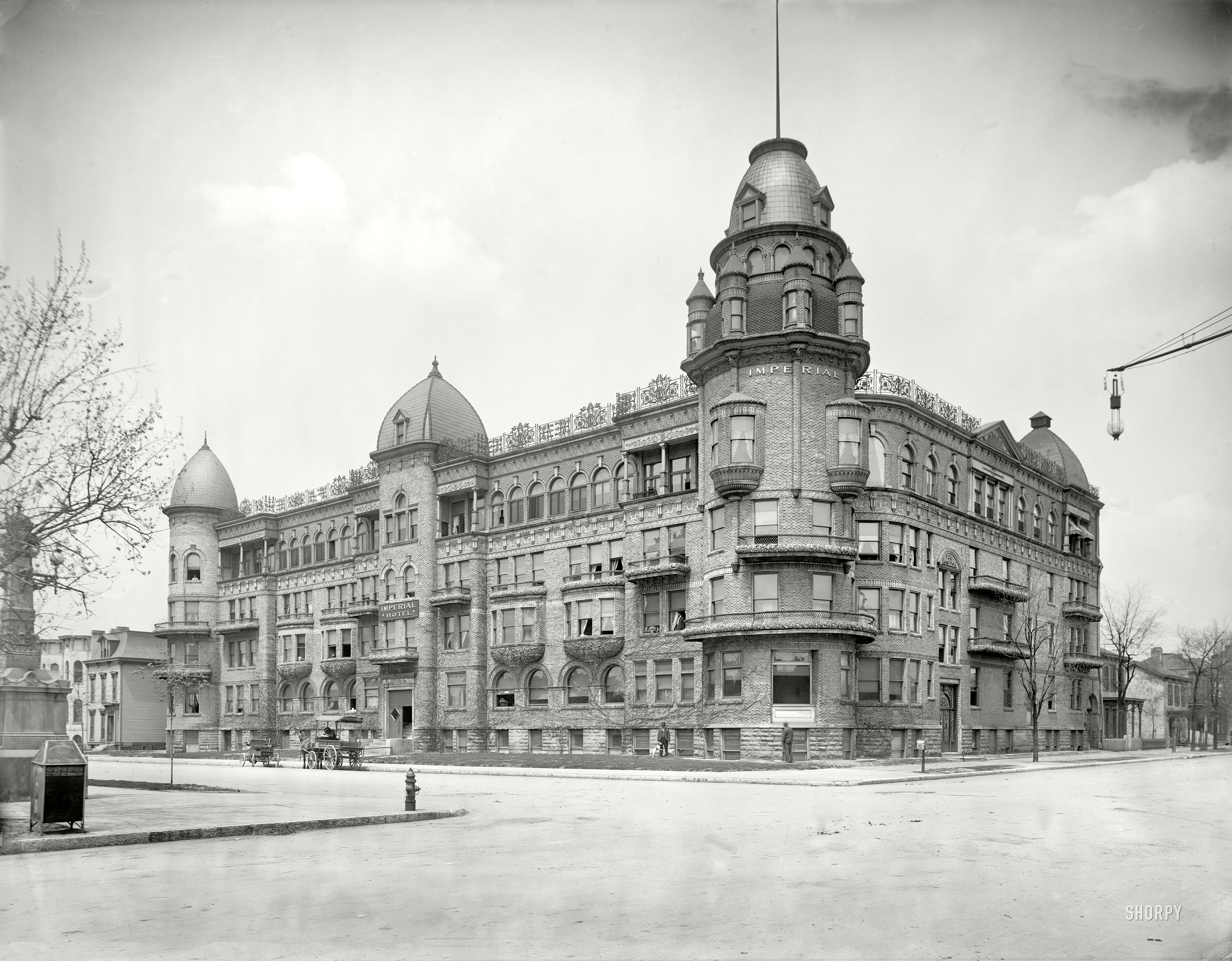 Indianapolis, Indiana, circa 1904. "Imperial Hotel." Whose architectural style might be described as Romanesque Rococo Curlicue Baroque, and whose slogan could be "every exterior surface embellished." Note the early automobile. 8x10 inch dry plate glass negative, Detroit Publishing Company. View full size.