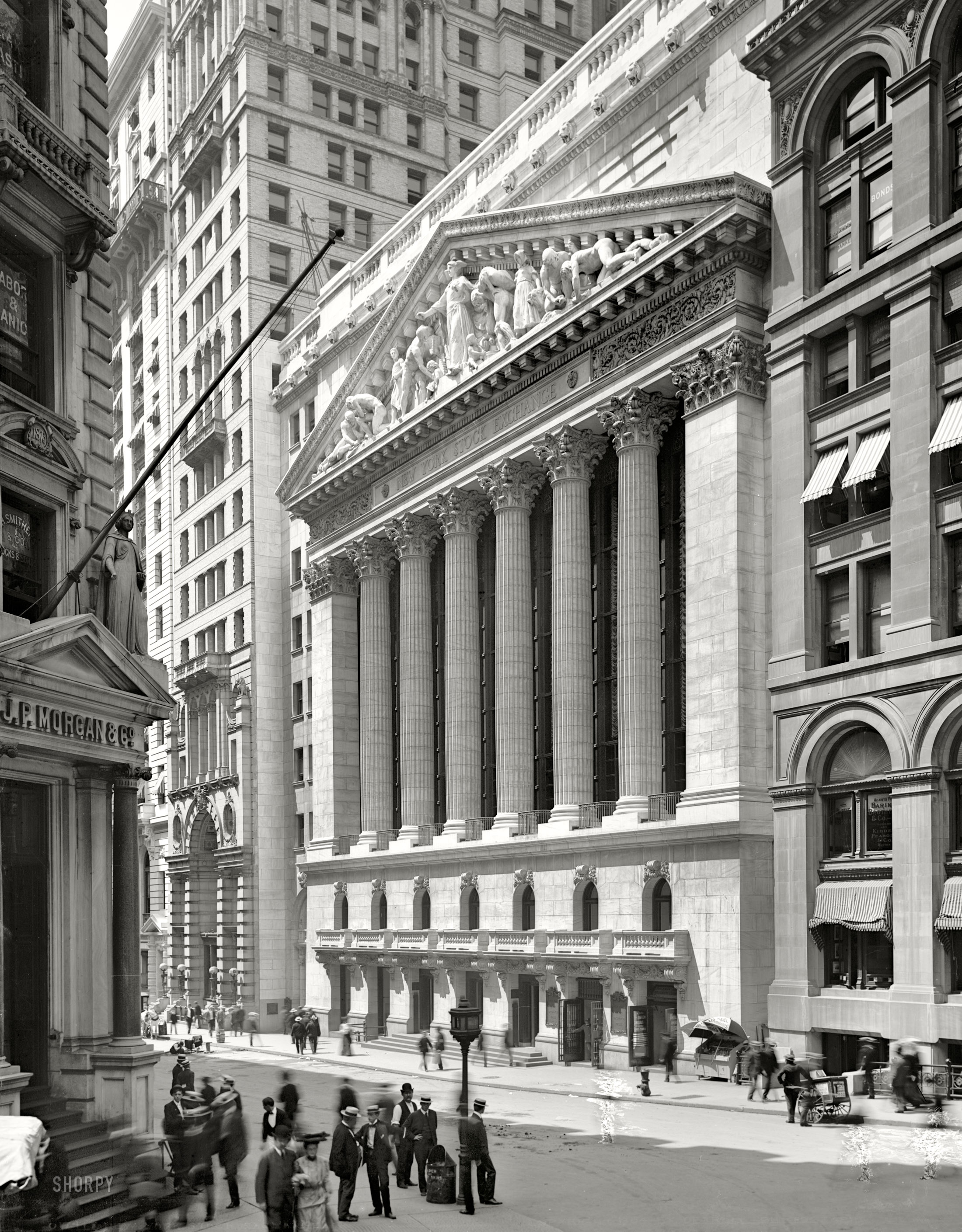 Lower Manhattan circa 1904. "New York Stock Exchange, Wall and Broad streets." Note the not very successful attempt to retouch three ghost pedestrians out of the picture. Detroit Publishing Company glass negative. View full size.