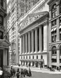 Lower Manhattan circa 1904. "New York Stock Exchange, Wall and Broad streets." Note the not very successful attempt to retouch three ghost pedestrians out of the picture. Detroit Publishing Company glass negative. View full size.
An Inquiring Mindwould like to know who sculpted the magnificent facade.
["Integrity Protecting the Works of Man" was designed by John Quincy Adams Ward in collaboration with Paul Wayland Bartlett and executed by Piccirilli Bros. of New York. In 1936, the 90-ton sculpture was replaced by a 10-ton replica. - Dave]
re: Tight Security NowI visited in 2002 and was surprised to find cops with assault rifles patrolling the barricaded street. I asked one what the special occasion was. He asked, "what do you mean?"
What an odd sculptureLike everyone is looking for their lost contact lens. Not to mention their clothes.
I guess we&#039;ll never knowI wonder why the photographer attempted to remove those specific persons from the shot.
[Because they're aesthetically imperfect and distracting! Most likely the photographers did not do the retouching. On the final product -- a colored postcard -- our blurry pedestrians would be completely obliterated. - Dave]
Tight Security NowThis is one of the most magnificent streets in all of NYC but now has extremely tight security - you can no longer drive on this street, there are metal barriers around the front of the NYSE so the average person can't walk up to the building, police have quite a presence there now, and last month I saw some kind of bomb detection trunk near there. They do fly the world's largest American flag in front of the pillars which helps but unfortunately obstructs the pillars of this beautiful building.
The Silver Surfer and FamilyActually it looks like The Silver Surfer has gone back in time with his family on holiday. The photographer appear to have used Photoshop Ver.-107.
J.P.This image shows a great juxtaposition between the Iconic Wall Street Exchange and J.P. Morgan's office building.  I can picture him walking out of there with that huge cigar of his, on the way to some deal.
Old GloryRespect etc. to the flag, but the building did look much better without it.
Interesting FacadeWhile the Stock Exchange is quite tall, its design avoids the presence of any windows more than two floors off the ground. Perhaps the architect was looking ahead to 1929.
Con Edison workerOn the extreme left of the photo is what appears to be a utility worker with his feet in a manhole and a temporary barrier setup. It is amazing what is frozen in time. Also I love the old style fire hydrants I believe they were phased out by around 1915, in my current town of Danbury, Connecticut, there is one just like it painted yellow on a forgotten triangle of land.
Air ConditioningDoes anyone have any photos of the air conditioning system that was installed in this building? It had a 300-ton comfort cooling system designed by an Alfred Wolff that used free cooling provided by a waste-steam-operated refrigeration system. It worked for 20 years. I'm researching it for an environmental controls class. Thanks!
+108Below is the same perspective from April of 2012.
(The Gallery, DPC, NYC)