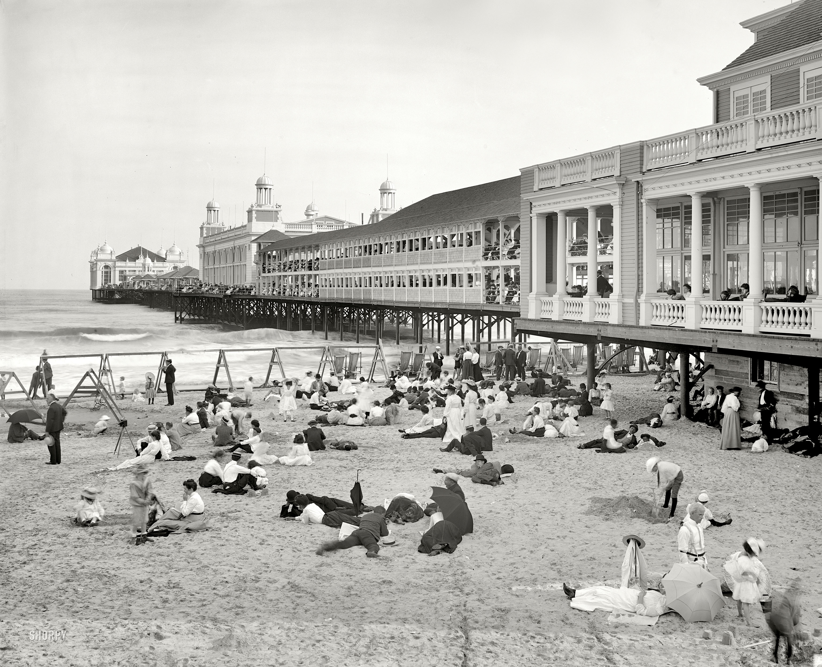 The Jersey shore circa 1904. "Steel Pier, Atlantic City." Can anything compare to Atlantic City in the summer, and the feel of sand in your bathing-socks? 8x10 inch dry plate glass negative, Detroit Publishing Company. View full size.