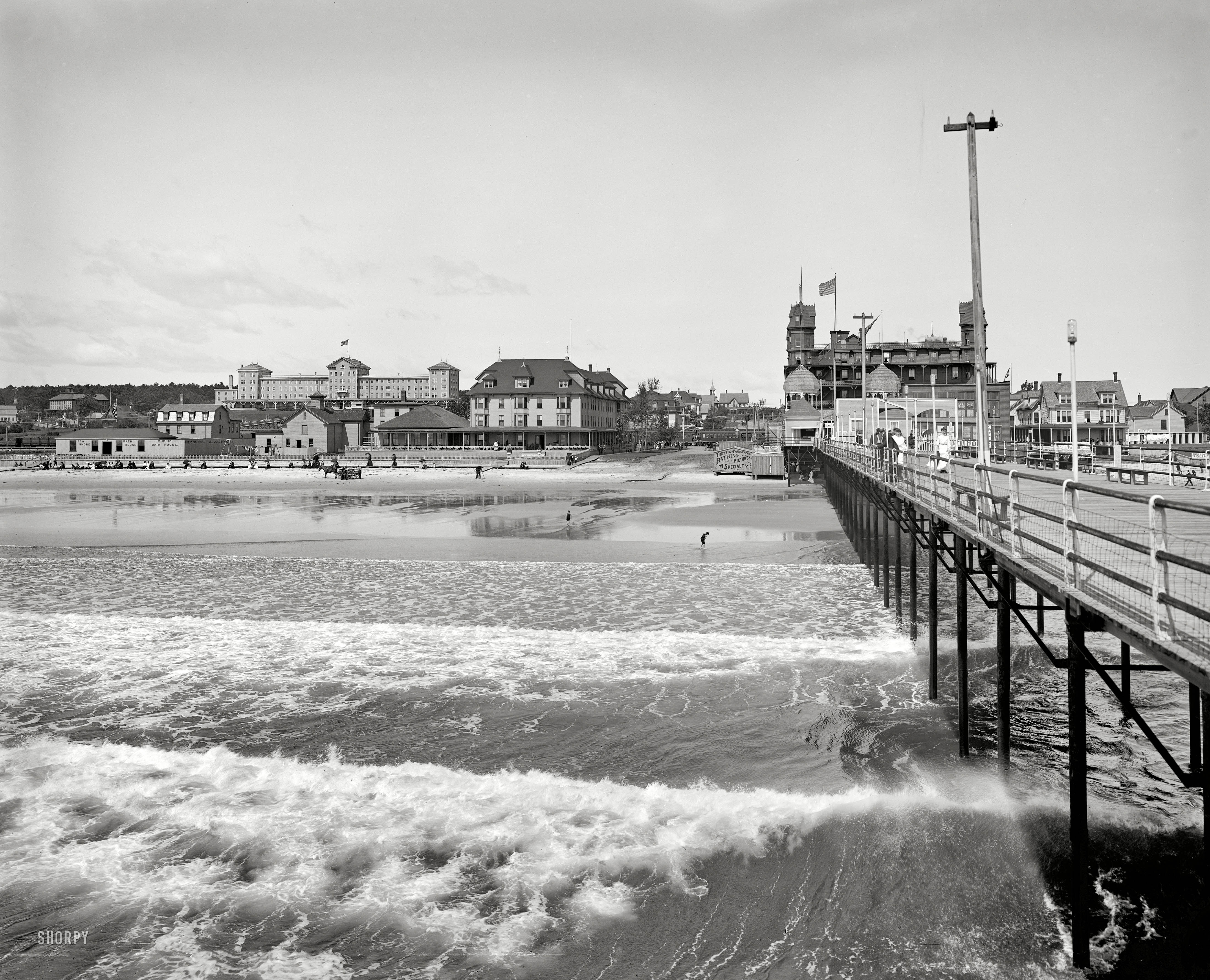 Circa 1904. "Old Orchard, Maine, from pier." Surf, sand, and Lady Zamora. 8x10 inch dry plate glass negative, Detroit Publishing Company. View full size.
