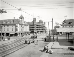 Old Orchard, Maine, circa 1904. "Alberta and Velvet hotels." 8x10 inch dry plate glass negative, Detroit Publishing Company. View full size.
Watching the train roll byAs youngsters we would watch the freight trains roll through this crossing. They were often 100 cars or more longer. I was told once that a train of 100 cars was over a mile long. We just amused ourselves counting them. 
Quatilitywas apparently a brand of cigar!
Quatility CigarsWith four times the tility of your average cigar.
Is the express coming?The crossing gates are down, but nobody seems to care. Nothing like a train hitting a cart full of cabin trunks.
Quatility!Quality AND utility, perhaps?
What you look for in a cigarQUATILITY
From the shredded flagto the high grade Quatility cigars, this is wonderful photo.
Spell-checkmust have been turned off for that "quatility" cigar sign. 
What this country needsIs a Quatility five cent cigar!
How things have changedThis isn't the OOB I know all too well! I live right down the street from there. The main difference is the lack of wannabe gangstas with shaved heads, gold chains, and basketball jerseys hanging around on every corner.
On a lighter note, the building on the right (behind the tracks) has since been replaced with Palace Playland. If you keep following the road that disappears behind the trees, that brings you to the OOB Pier. There are bars &amp; restaurants out there that are staffed with beautiful Russian girls.  
Danger! Do not cross!Hand trucks full of steamer trunks may appear without warning!
Crossarms are down!Will we get to see the train passing though in a future pic?
Railroad crossingLook out for the cars. Can you spell that without any R's? 
Scrabble, anyone?Googling "quatility" gives over 20,000 results. Is our schooling really THAT bad?
ConflagrationYou knew it had to happen.
That&#039;s Cute!I love the kid getting the free ride on the dolly. That's just a nice man.
(The Gallery, DPC, Railroads)