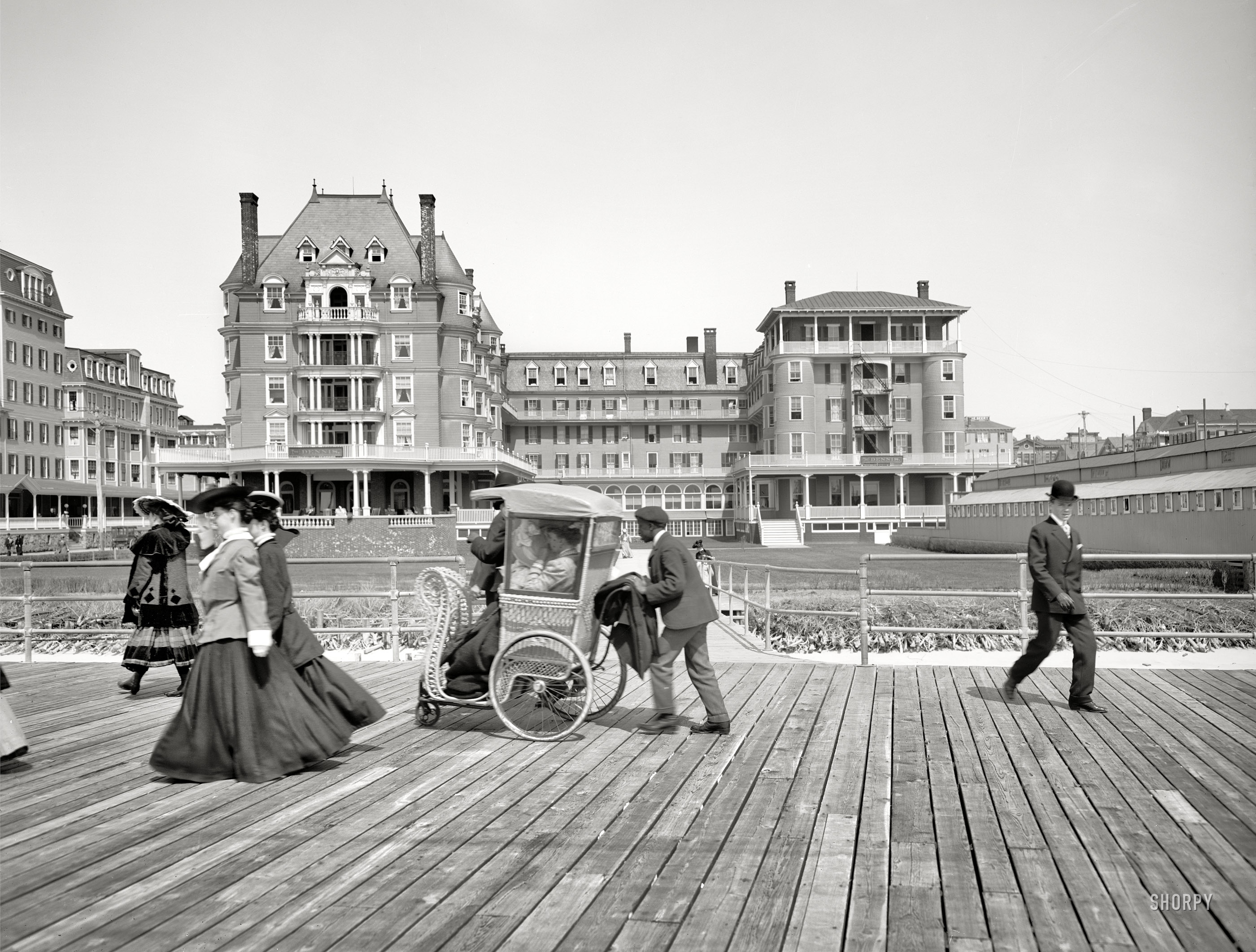 Atlantic City, New Jersey, circa 1905. "The Dennis." Where you can get pushed around on the Boardwalk. 8x10 inch glass negative. View full size.