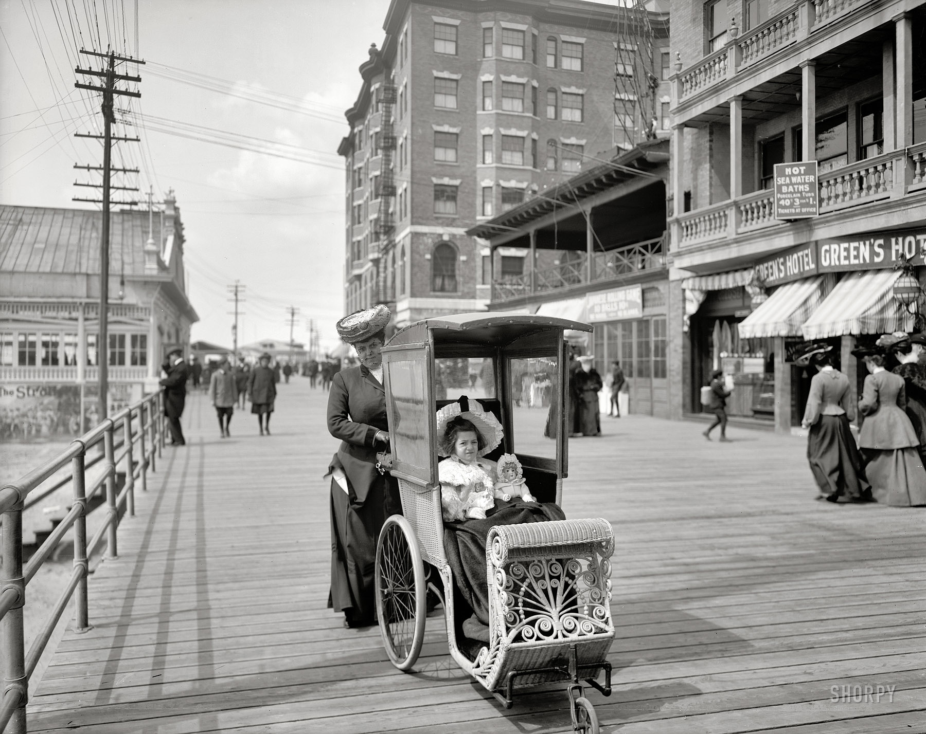 Atlantic City, New Jersey, circa 1905. "Dolly's go-cart." Behind this little princess: a pushy mother. 8x10 inch glass negative, Detroit Publishing Co. View full size.