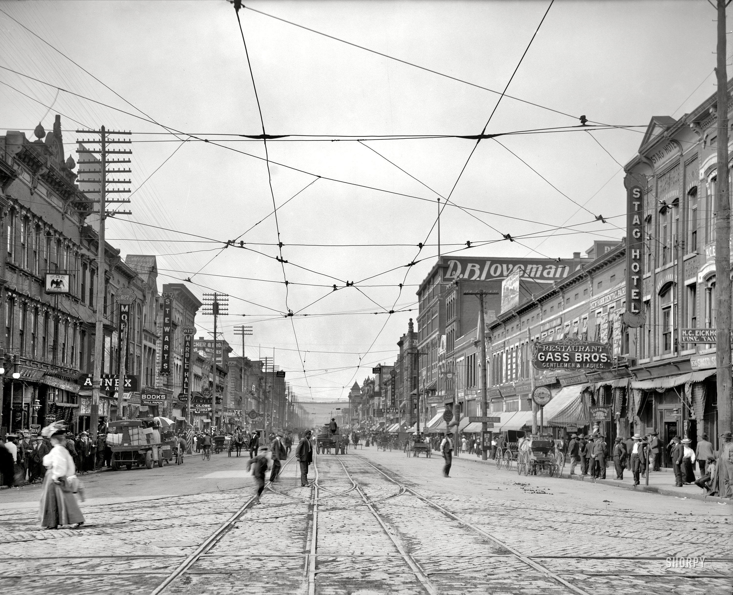 Chattanooga, Tennessee, circa 1907. "Market Square." Beneath a cat's cradle of streetcar wires, we have a nice selection of restaurants and dental parlors. 8x10 inch dry plate glass negative, Detroit Publishing Company. View full size.
