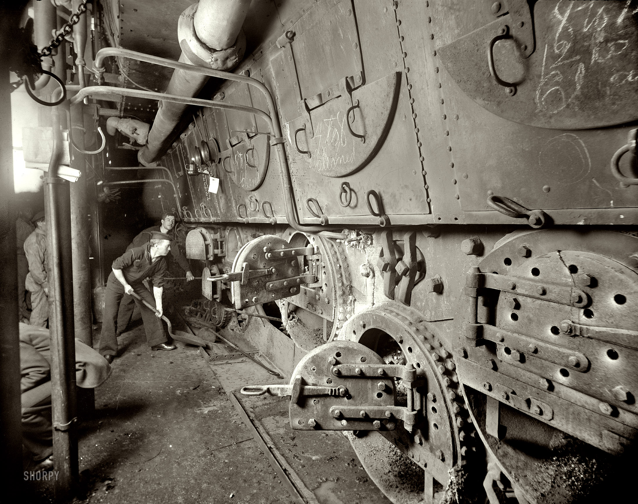 Circa 1897. "U.S.S. Massachusetts, fire room." Tending the battleship's coal-fired boilers. Photo by Edward H. Hart, Detroit Publishing Co. View full size.