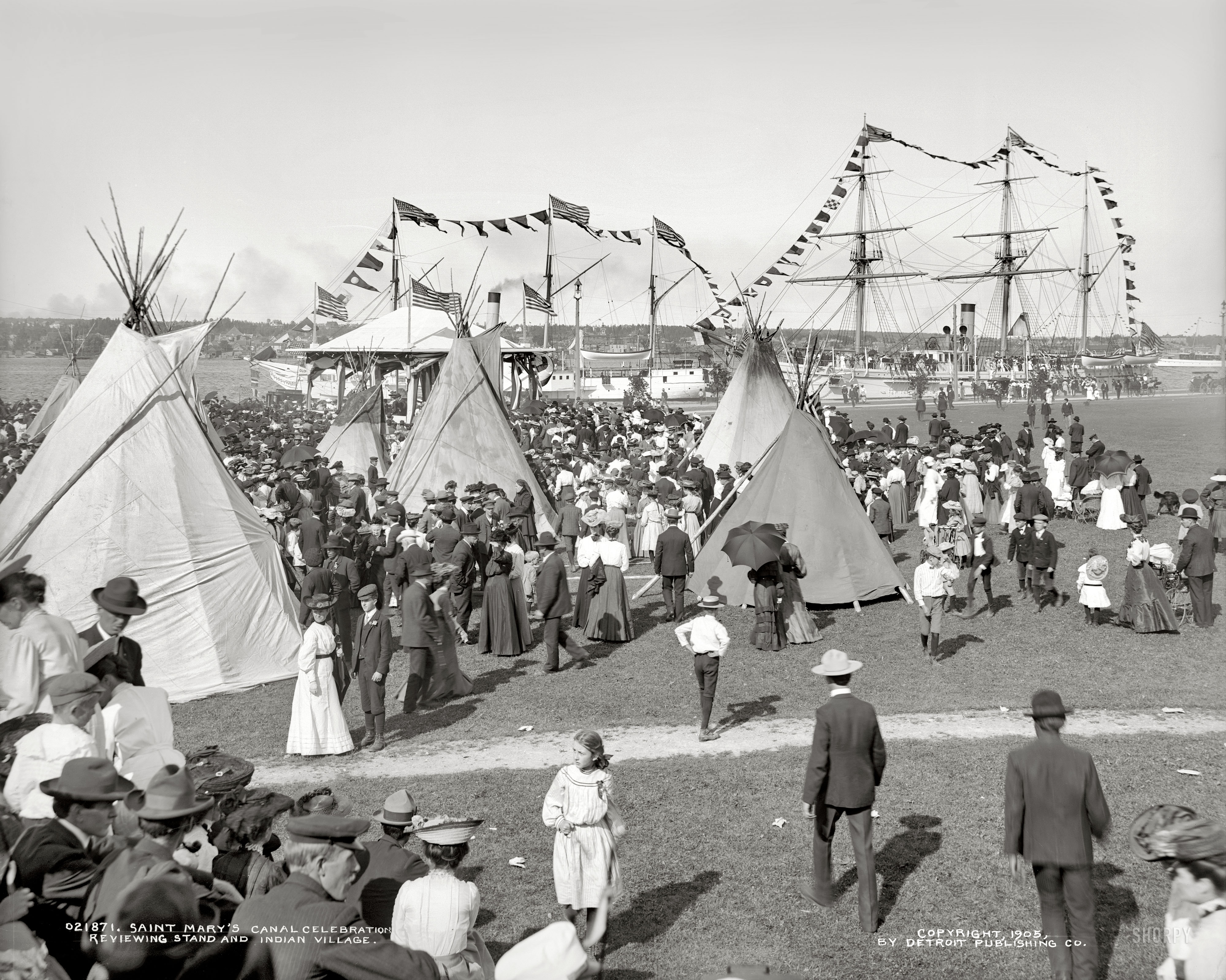 Michigan circa 1905. "Sault Sainte Marie Canal celebration. Reviewing stand and Indian village." Dry plate glass negative, Detroit Publishing Co. View full size.