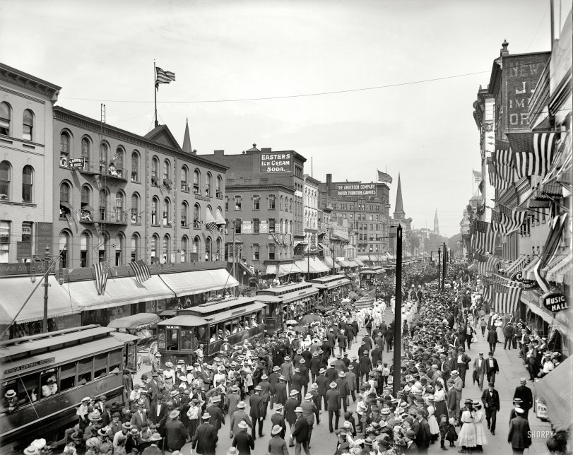 Buffalo, New York, 1900. "Labor Day parade, Main Street." The Clairvoyant Bird Woman observes from her perch. Detroit Publishing Company. View full size.
