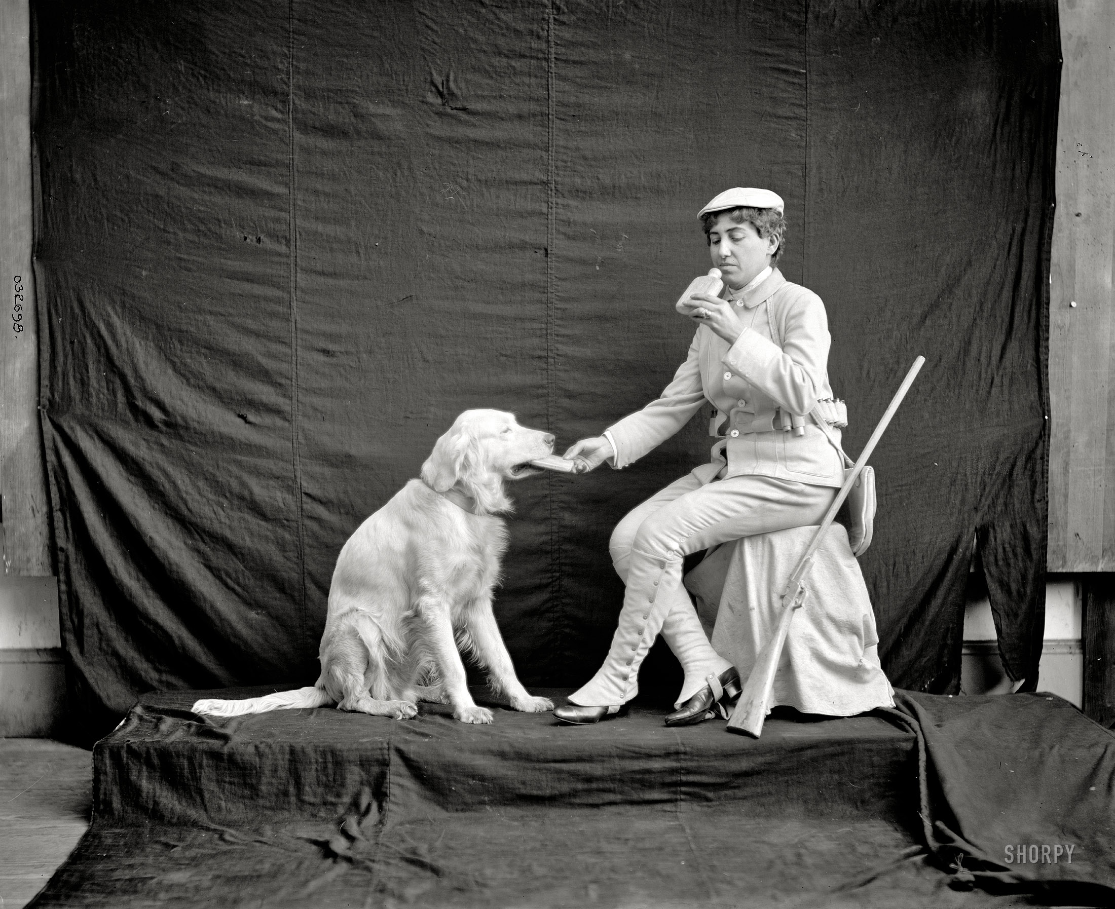 Circa 1900s. "Billy and his mistress in hunting poses." One of eight curious portraits of this statuesque pair, who appear almost whitewashed. 8x10 inch dry plate glass negative, Detroit Publishing Company. View full size.