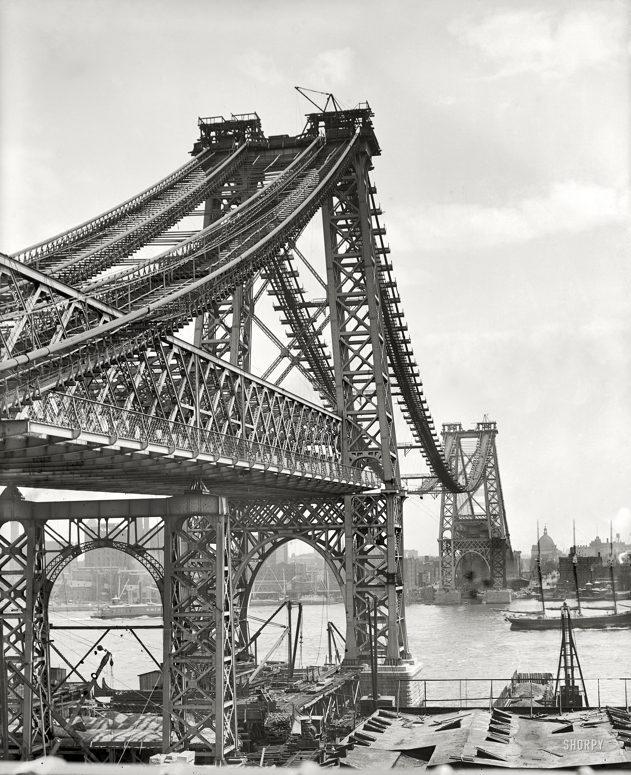 New York circa 1902. "New East River bridge from Brooklyn." The Williamsburg Bridge under construction. Detroit Publishing Company. View full size.