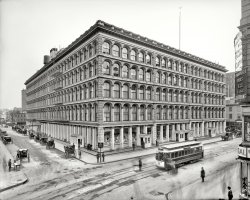 New York circa 1906. "John Wanamaker store, Broadway and 10th Street." 8x10 inch dry plate glass negative, Detroit Publishing Company. View full size.
My condiments to the chefThis was taken several years before Ivan Frank and the Hamburger brothers merged to form their extremely successful sports food monopoly.
Early radio, tooBoston American, April 16, 1912 - ...The [wireless office of the Wanamaker stores at Broadway and Eighth streets] was directed by David Sarnoff, manager of the station, assisted by J. H. Hughes, an expert Marconi operator. With every bit of energy at their command the men stood by their work and fired scores of messages and caught many concerning the wreck [of the Titanic]. From all over the coast line and far into the interior, even to Chicago, appeals for news of the disaster were heaped upon the temporary office.
Sarnoff went on to become a business and broadcasting legend as leader of both NBC and RCA. The wireless station was in the 14-story annex, built in the years immediately after the 1906 photo was taken.
The Little Tramp.I do believe that's Charlie Chaplin, leaning on a lamppost at the corner of the street, in case a certain little lady comes by. Oh me, oh my!
Beautiful buildingMore about the building here and here.
Pathé has newsreel footage of it burning in July 1956.
Wanamaker&#039;swas originally A.T. Stewarts store, is now occupied by the Stewart House co-ops.  The building in the Shorpy photo burned down in 1956.  Wanamaker's other building, one block south still stands.
Hamburger BrothersThere's a name you don't see anymore, attached to anything but sandwiches.
Wanamaker's, on the other hand, is so decorous that for the lack of signage, the only way to find it is to stop at the line of waiting Hansom cabs.
AnnexI used to work in the early 70's for Amex. It was located in 770 Broadway. It had been the Wanamaker's Annex (were the sign that says "Annex" is in the picture). It had been converted to office space when the store closed. The elevators went from the lobby with he first stop at "3". I never thought about it until some of us decided that instead of waiting for the elevator at five that we would walk down. The stairway still had the old gas jets, but what was really interesting was that there was a door on the second floor (the one that the elevators could not stop at) that said "U S Army Engineers Manhattan District"! I never forgot that.
The three youngsters near the cornerLooks like they knew they were getting their picture taken!
Early TelevisionIn 1945 the DuMont Television Network created three studios at Wanamaker's including one of 2,000 square feet, seating 280. DuMont's local station was WABD Channel 5, now WNYW "Fox 5."
The Annex - Take 2I think we can push the date of this photograph back a few years, because Wanamaker's Annex is nowhere to be seen.
[Look closer. - Dave]
Dave, that's not the 14-story building I'm talking about (Wanamaker's Annex, D. H. Burnham &amp; Co., 1903-1907) - you know, the building I described in the paragraph I sent you, before you edited it down to one sentence.
Guys &amp; DollsMarry the Man Today:
At Wanamaker's and Saks and Klein's
A lesson I've been taught
You can't get alterations on a dress you haven't bought
At any vegetable market from Borneo to Nome
You mustn't squeeze a melon till you get the melon home
You've simply got to gamble
You get no guarantee
Now doesn't that kind of apply to you and I?
You and me!
Why not?
Why not what?
Marry the man today
Trouble though he may be
Much as he likes to play
Crazy and wild and free
Marry the man today
Rather than sigh in sorrow
Marry the man today
And change his ways tomorrow
(The Gallery, NYC, Stores & Markets, Streetcars)