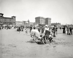 The Jersey Shore circa 1910. "On the beach at Atlantic City." 8x10 inch dry plate glass negative, Detroit Publishing Company. View full size.
Great GunsThe lady looks like she could crack a walnut in the crook of her elbow. Those are some impressive arms for a woman. Hands too.
Tights on the BeachI still marvel at the sight of these women in their stockings or is it tights?  Compare them to how the men are dressed.
What also amazes me is no more than a decade later how different fashion would become for women.
Different perspectiveI don't remember seeing a photograph quite like this. The camera is angled to view from the ocean. No more boardwalks or piers seen in this pic. 
Ah!  The Jersey Shorebefore there was a Situation or a Snooky.  Those were the days!!!
Just wait til I tell Opie and Andy about this!My dress hiked nearly up to my knee, almost my entire Stocking showing, and in public! 
My word, I'll be the scandal of Mayberry!
The two guys at rightlook as if they could be with the photographer.  Definitely appears to be a large camera case on the sand, and the pouch slung over the shoulder of the taller one looks about right for the plates.
(The Gallery, Atlantic City, DPC, Swimming)