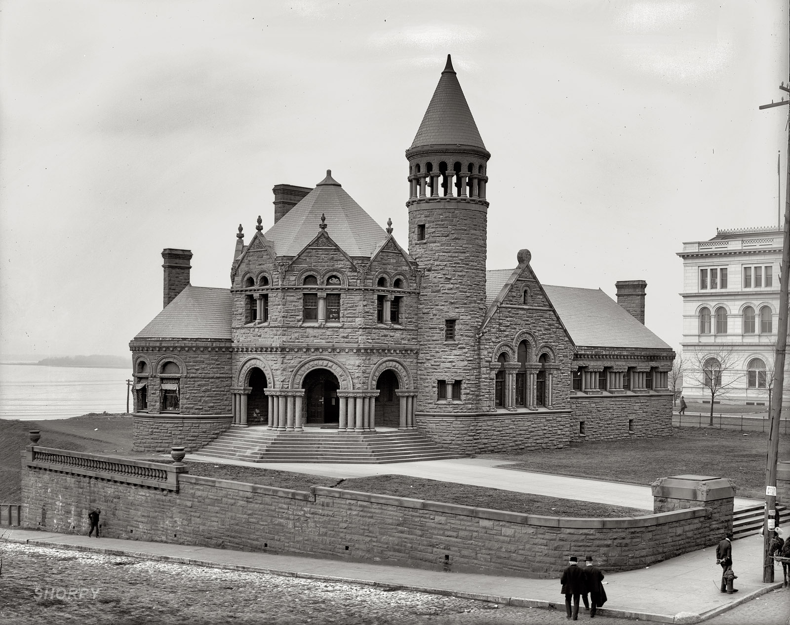 Circa 1906. "Cossitt Library, Memphis." This Romanesque red sandstone structure, at Front and Monroe on the banks of the Mississippi, was Memphis's first public library when it opened in 1893. Detroit Publishing. View full size.