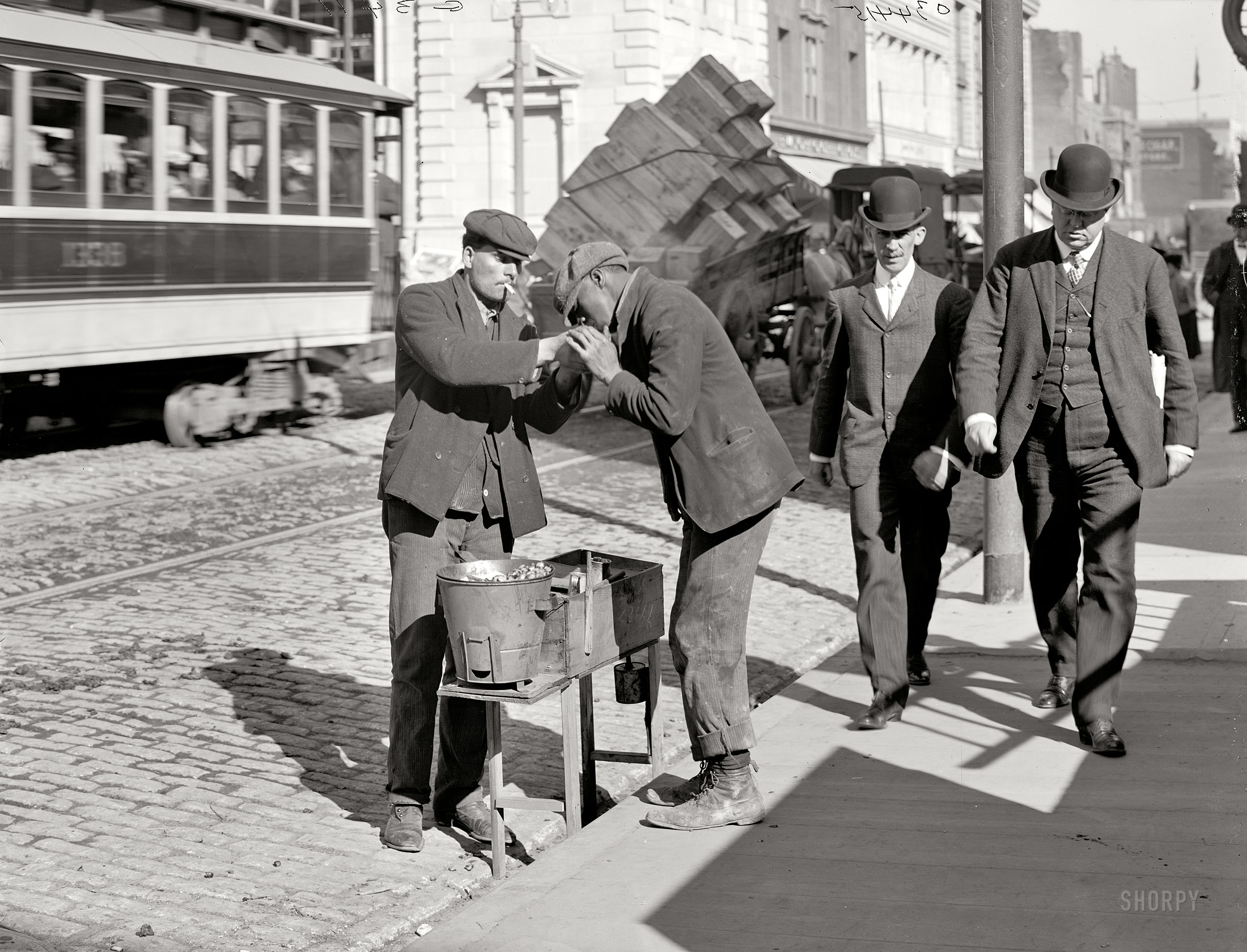 Baltimore, Maryland, circa 1905. "A chestnut vendor." 8x10 inch dry plate glass negative, Detroit Publishing Company. View full size.