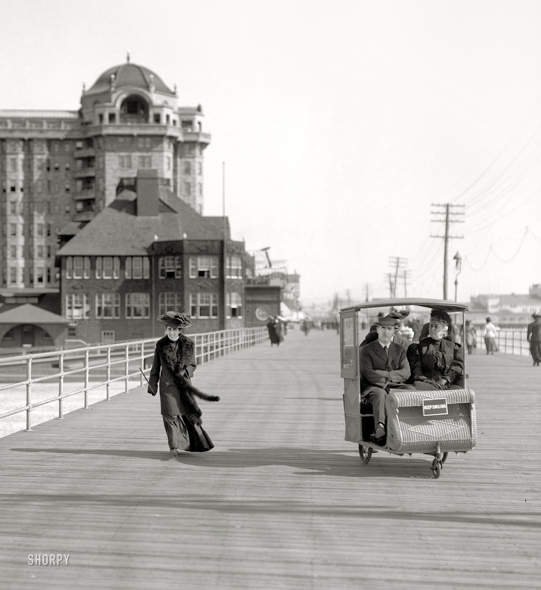 The Jersey shore circa 1906. "Rolling chair on the Boardwalk, Atlantic City." In the distance, the giant safety razor seen on the Gillette sign in the previous post. 8x10 inch dry plate glass negative, Detroit Publishing Company. View full size.