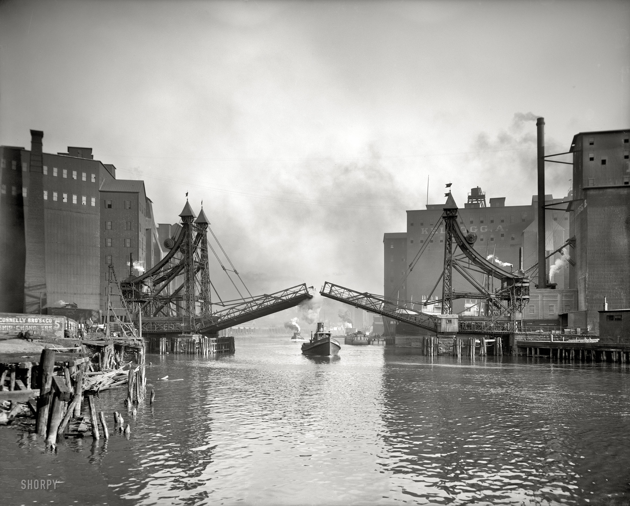 Buffalo, New York, circa 1905. "Jack-Knife Bridge, City Ship Canal, foot of Michigan Street." Detroit Publishing Company glass negative. View full size.