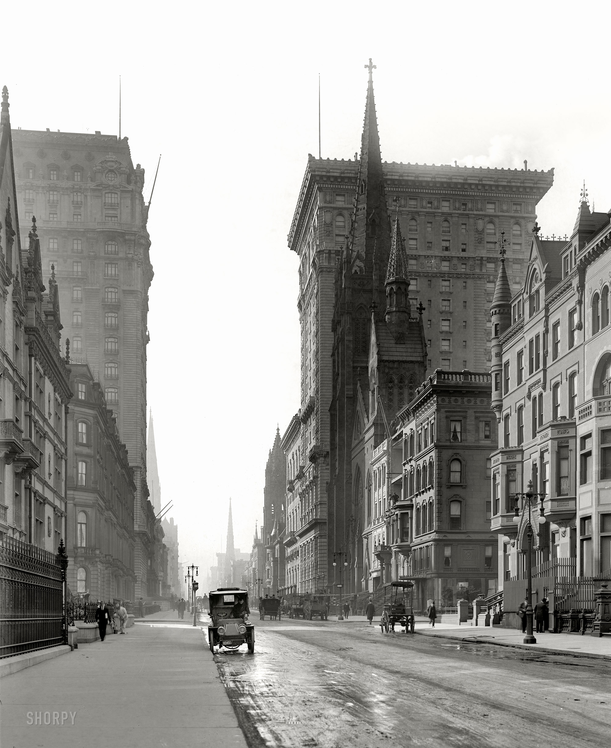New York circa 1905. "Gotham and St. Regis hotels." Looking south along Fifth Avenue at East 56th Street. On the right, the Gotham rising behind Fifth Avenue Presbyterian Church. Detroit Publishing Company glass negative. View full size.