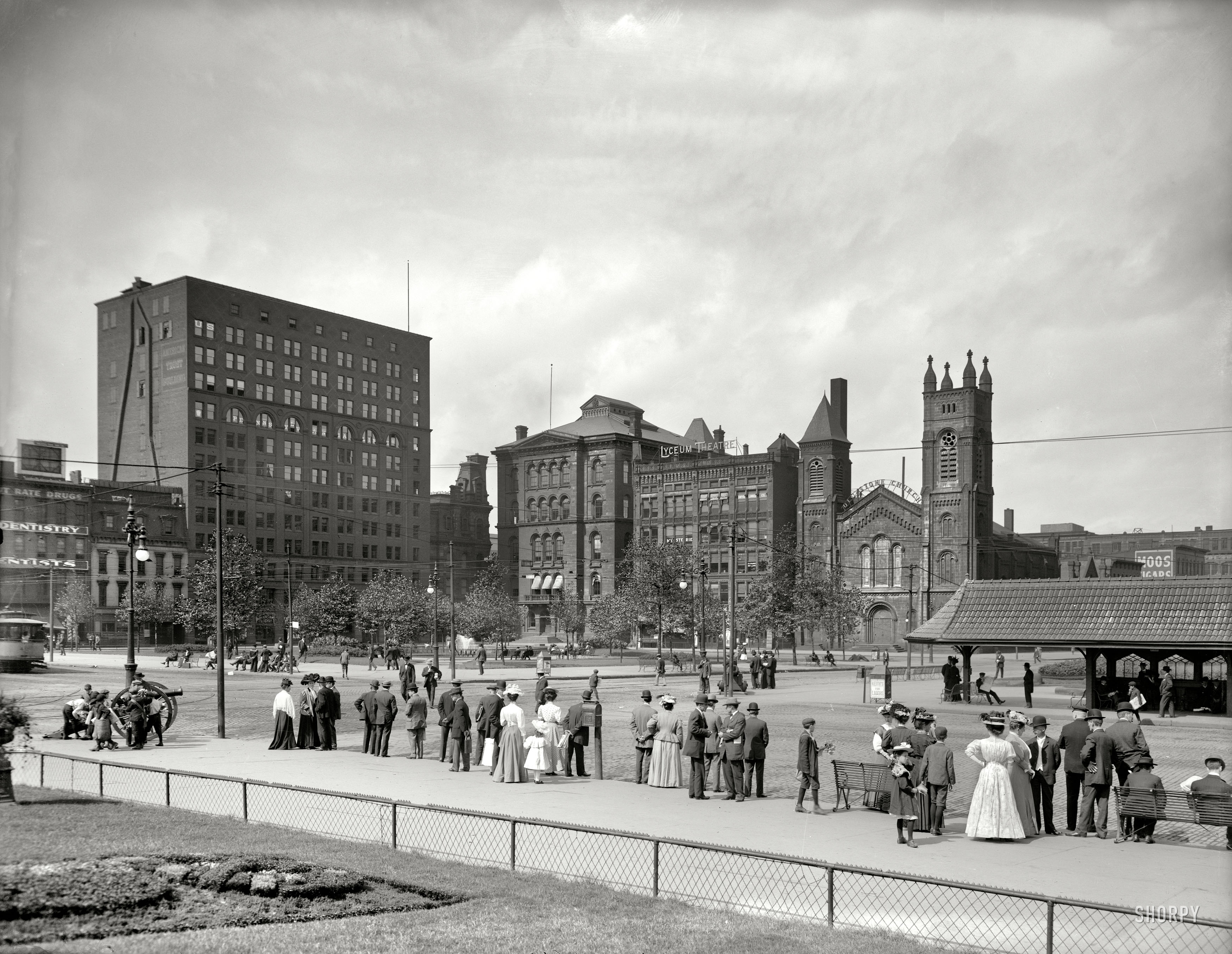 Cleveland, Ohio, circa 1905. "Public Square. Lyceum Theatre and Old Stone Church in background; people waiting for streetcar." 8x10 inch dry plate glass negative, Detroit Publishing Company. View full size.