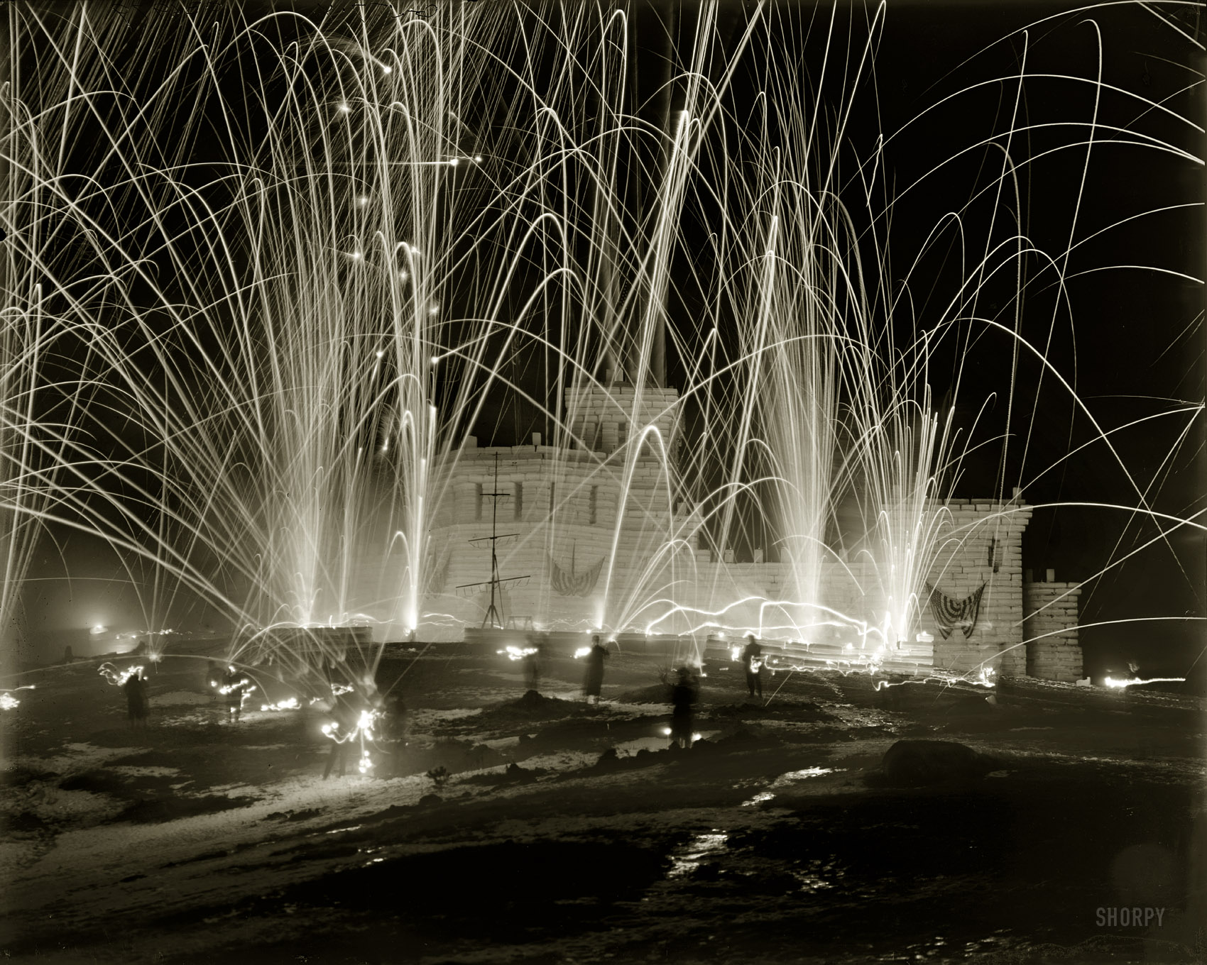 1909. "Mid-winter carnival, 'storming the fortress,' Upper Saranac Lake, New York." Detroit Publishing Company glass negative. View full size.