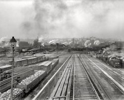 Scranton, Pennsylvania, circa 1900. "Delaware, Lackawanna, and Western Railroad yards." Judging by the fellow in the white coveralls, I'd say this plate was exposed not long after this one. Detroit Publishing Co. View full size.