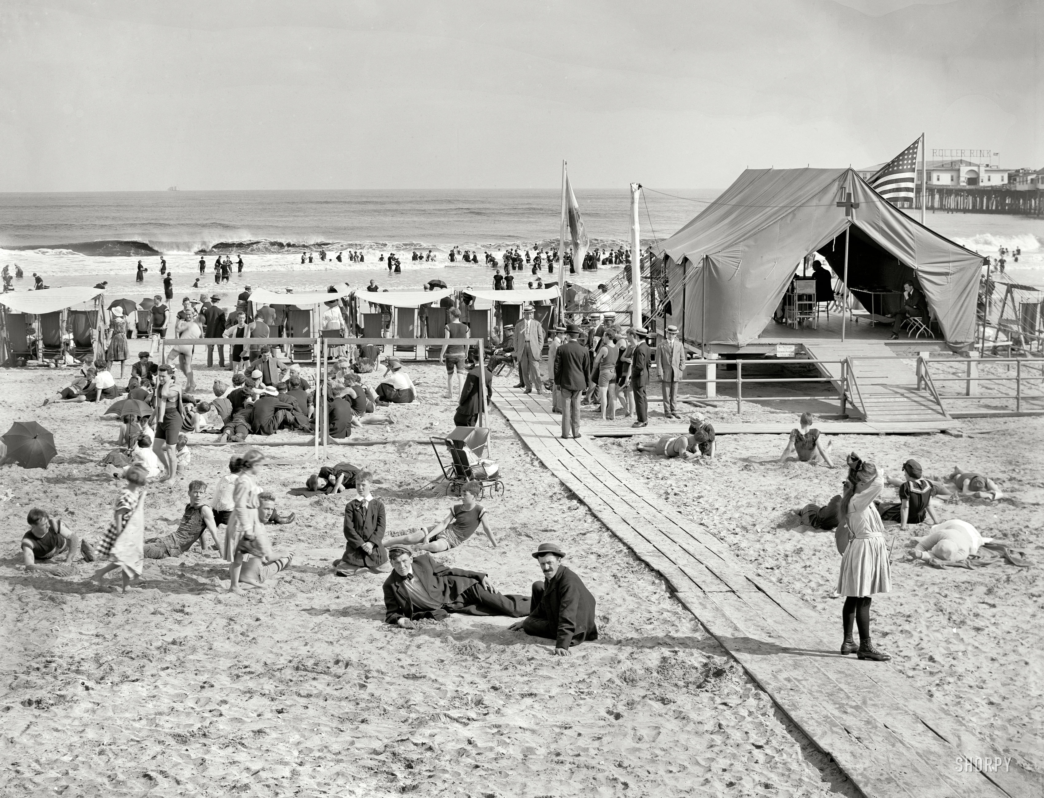 Circa 1915. "Surf bathing at Atlantic City." Where not all the suits are for swimming. 8x10 inch glass negative, Detroit Publishing Co. View full size.