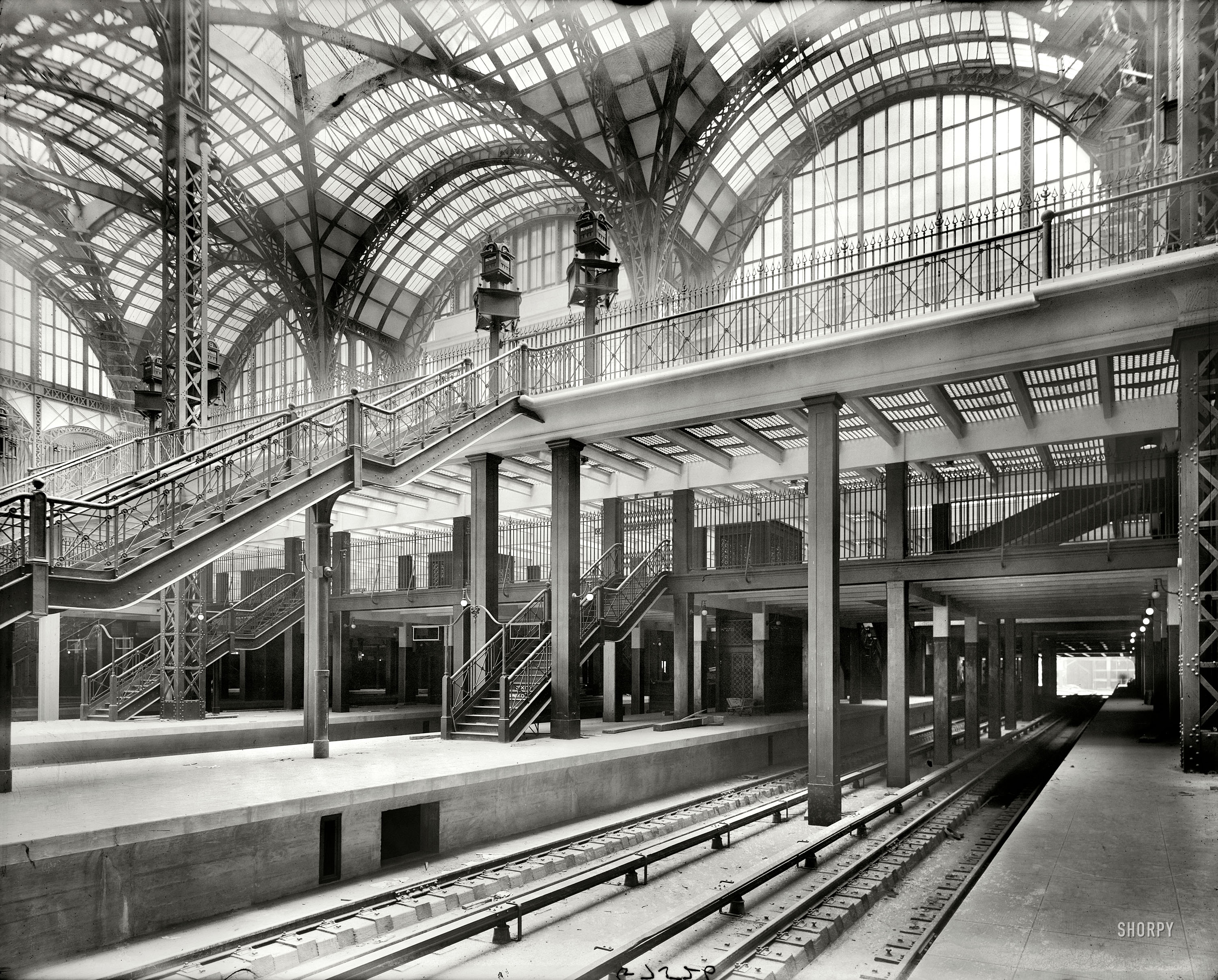New York circa 1910. "Pennsylvania Station, track level, showing stairway and elevators." 8x10 inch glass negative, Detroit Publishing Company. View full size.
