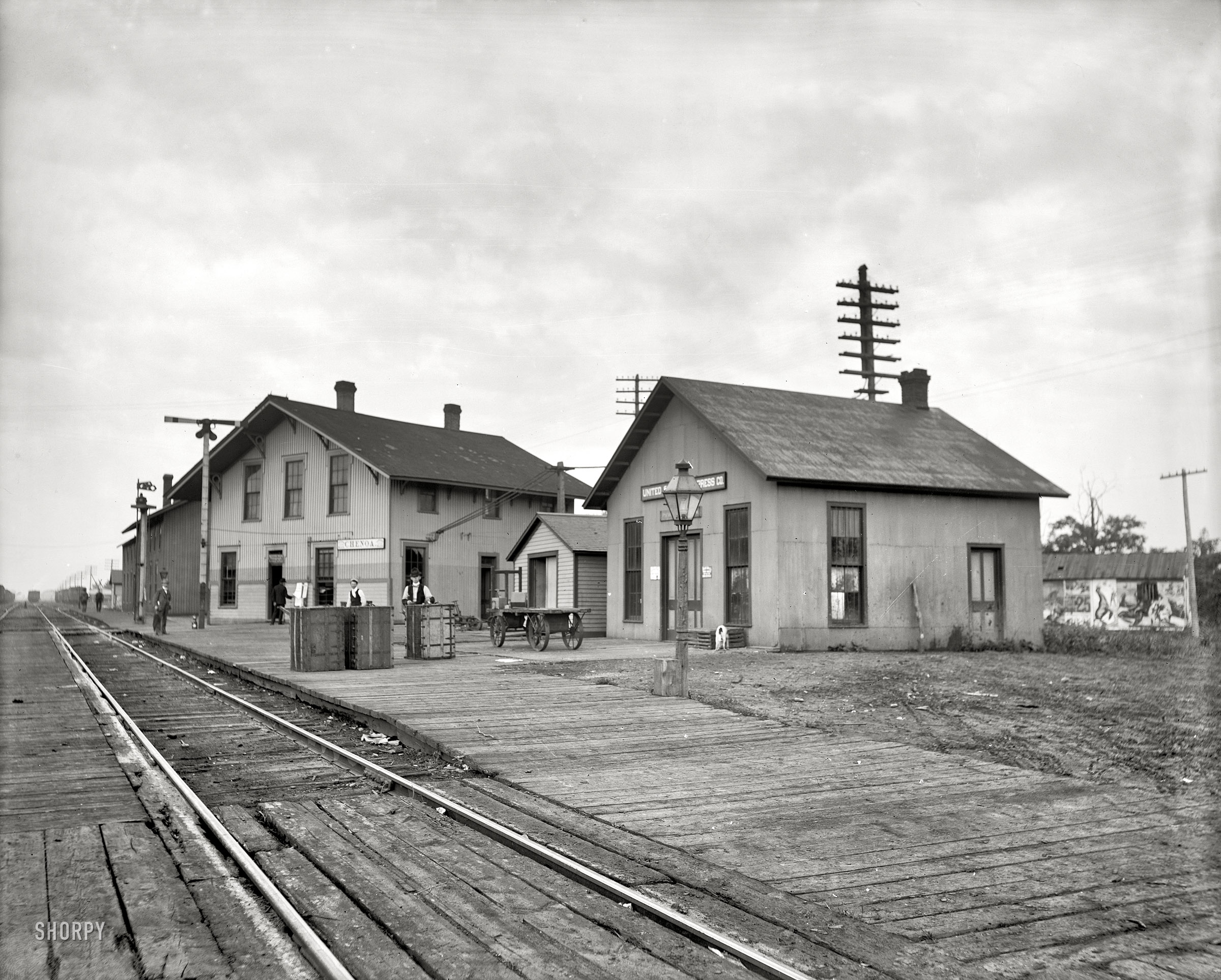 Circa 1905. "Station & buildings at Chenoa, Illinois." Plus: circus posters! 8x10 inch dry plate glass negative, Detroit Publishing Company. View full size.
