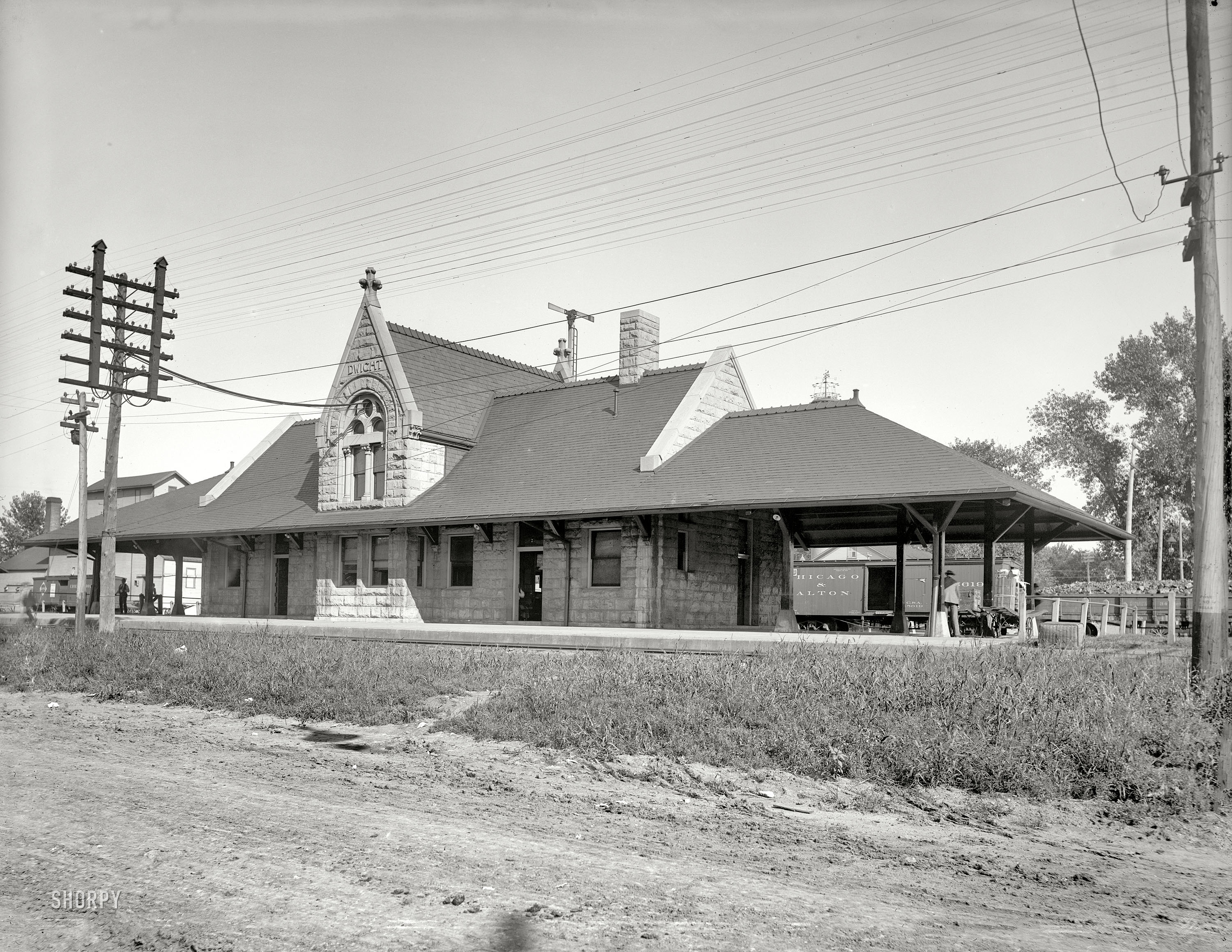Circa 1900. "Chicago & Alton station at at Dwight, Illinois." Home to a very healthy looking telegraph pole. Detroit Publishing glass negative. View full size.