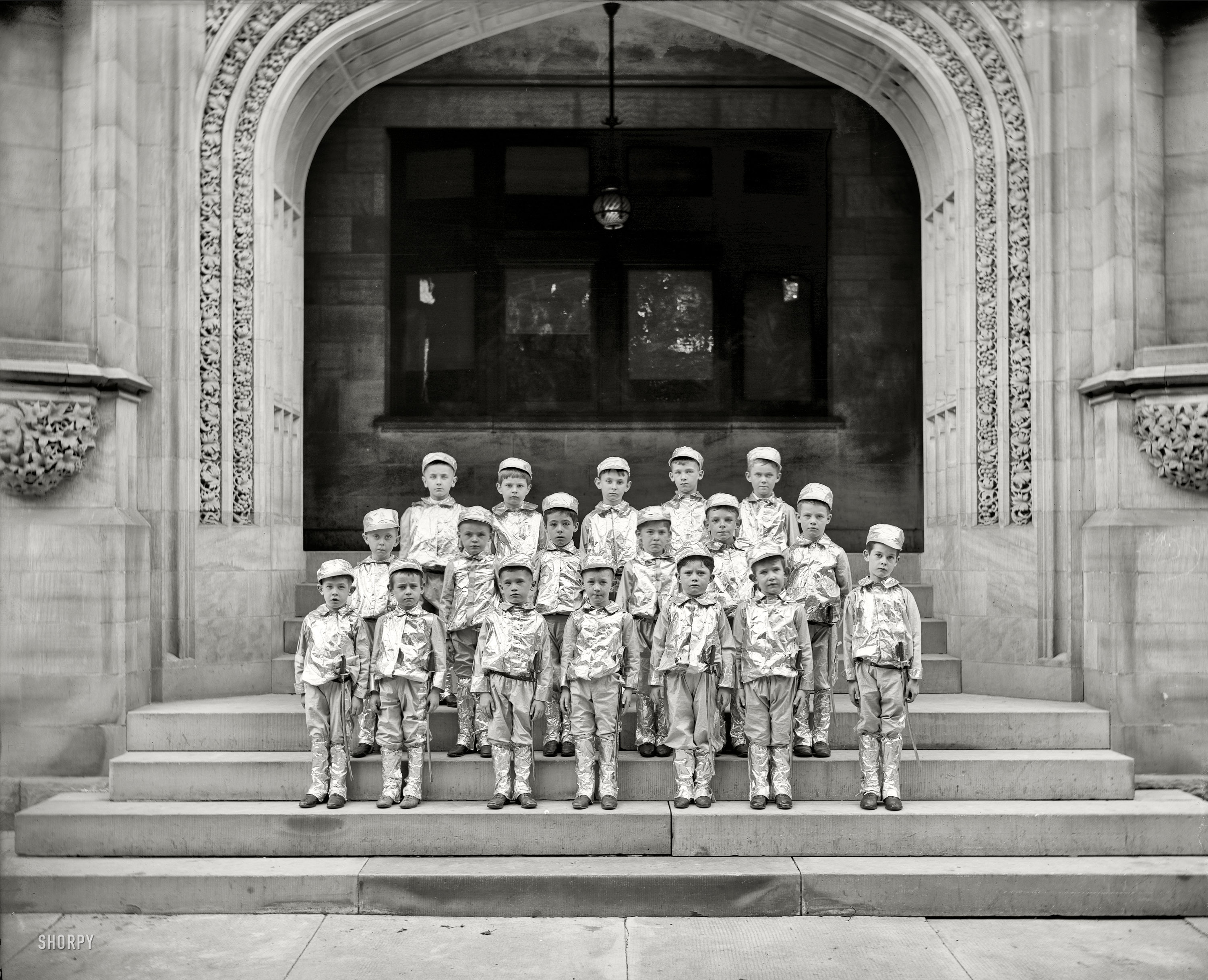 Circa 1905. Anyplace, USA. "Schoolboys." In spiffy foil uniforms. 8x10 inch dry plate glass negative, Detroit Publishing Company. View full size.
UPDATE: This is the Saints Peter and Paul Academy, 64 Parsons St., Detroit. 