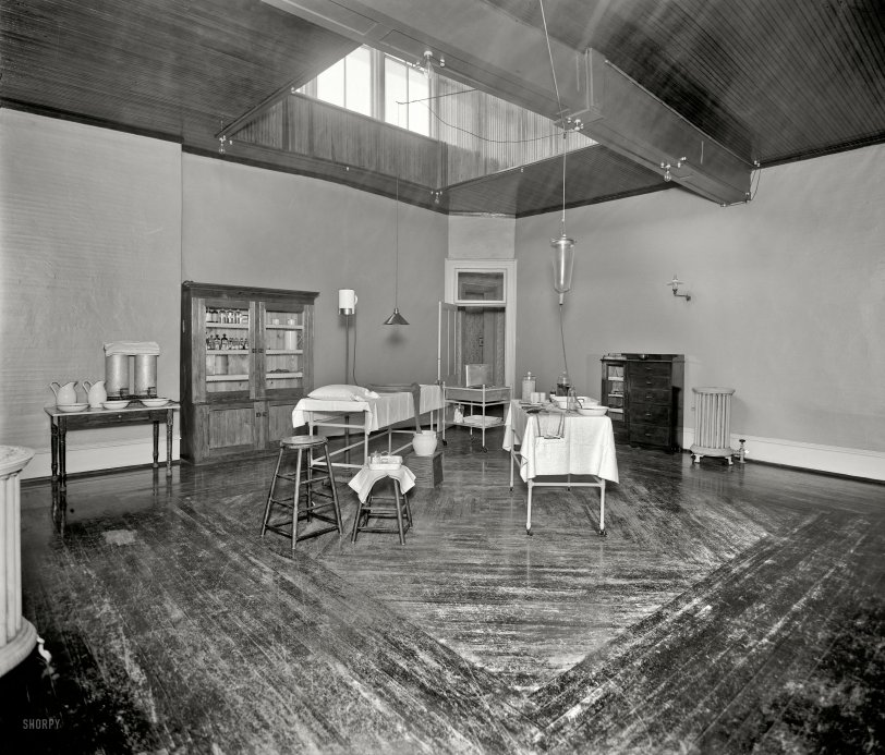 Circa 1900. "Room with medicine cabinet, basins, and massage or treatment table, probably the Ypsilanti mineral bath house." Note the can of ether in what looks to me like an operating room. Detroit Publishing glass negative. View full size.
