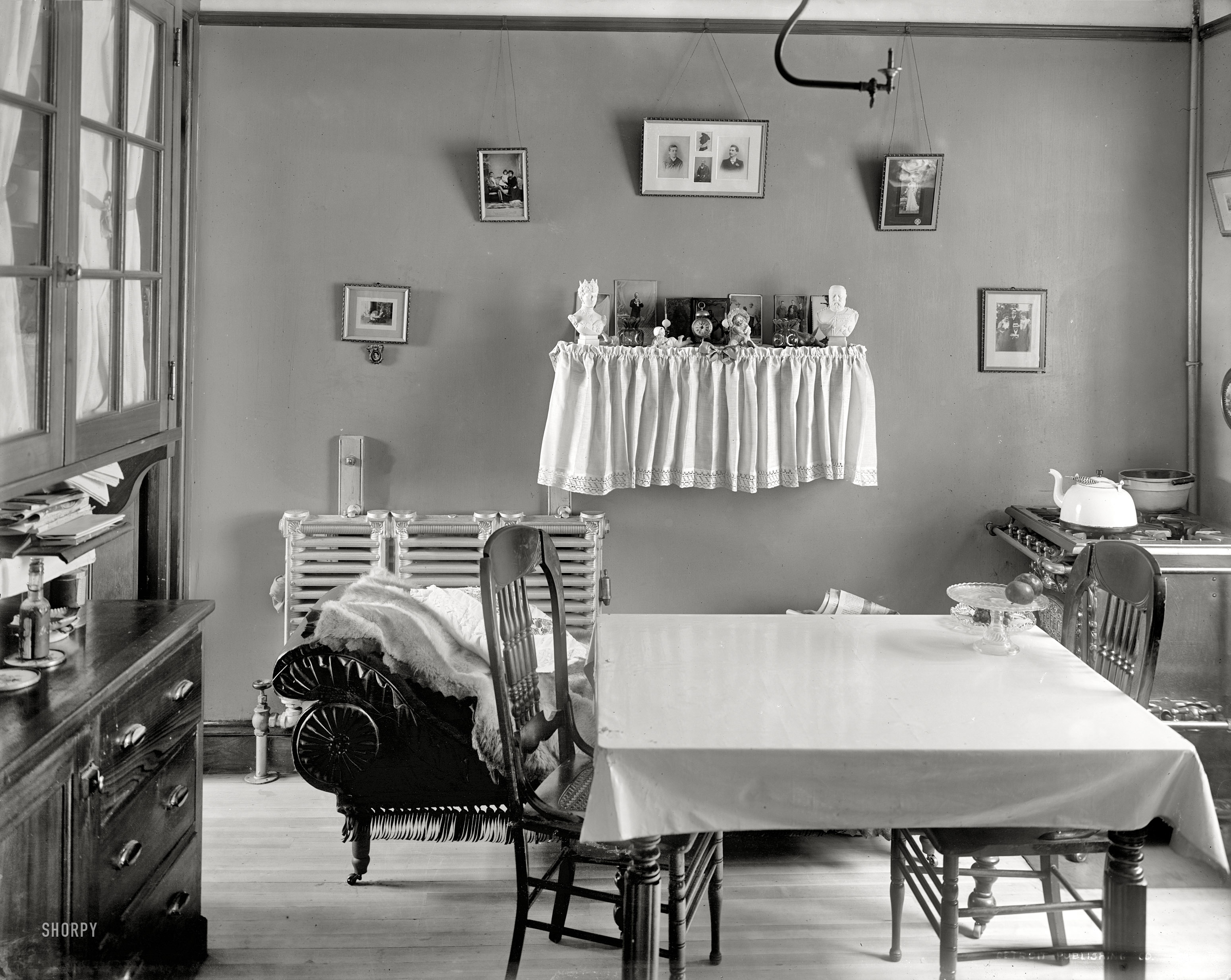 New York circa 1905. "Interior of tenement." All the conveniences, including a somewhat incongruous couch on wheels.  8x10 glass negative. View full size.